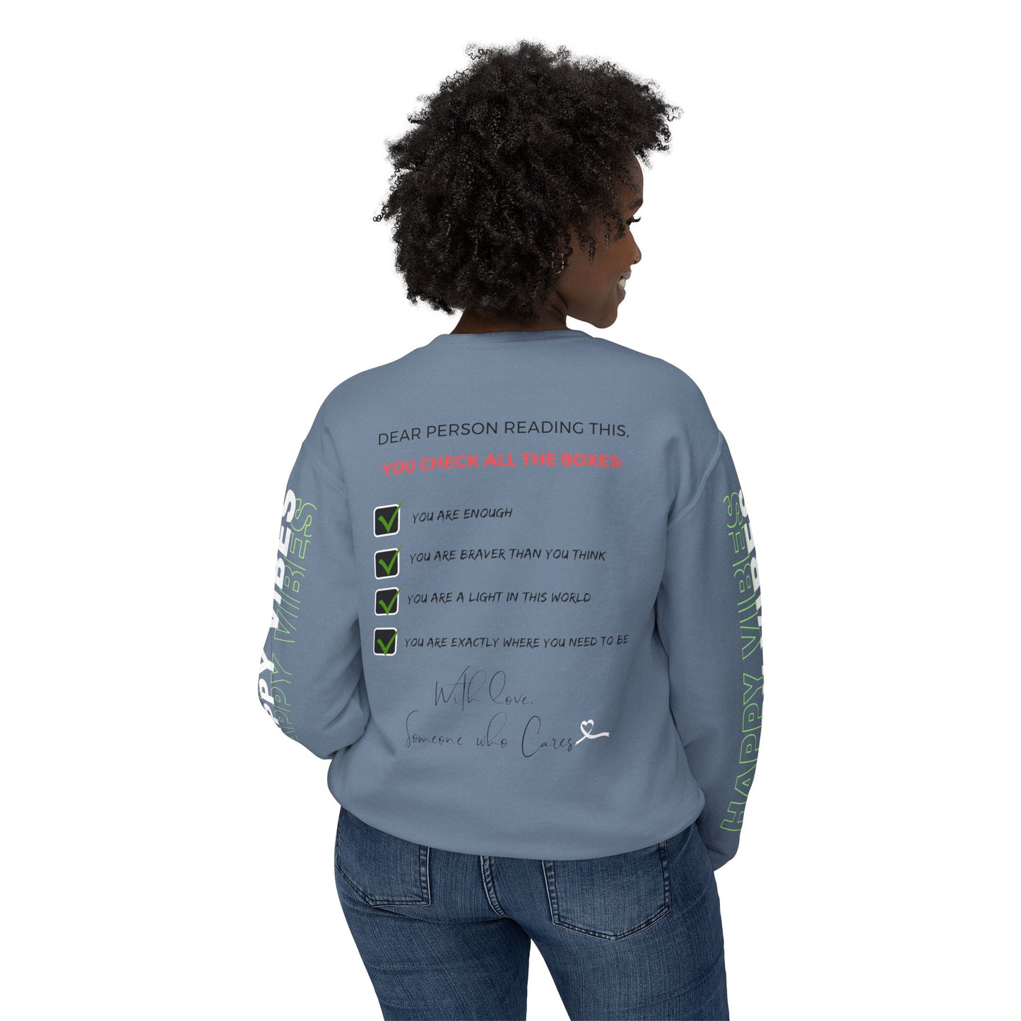 Woman showcasing the back of the Happy Vibes Unisex Sweatshirt with a checklist of positive affirmations. Blue Jean color