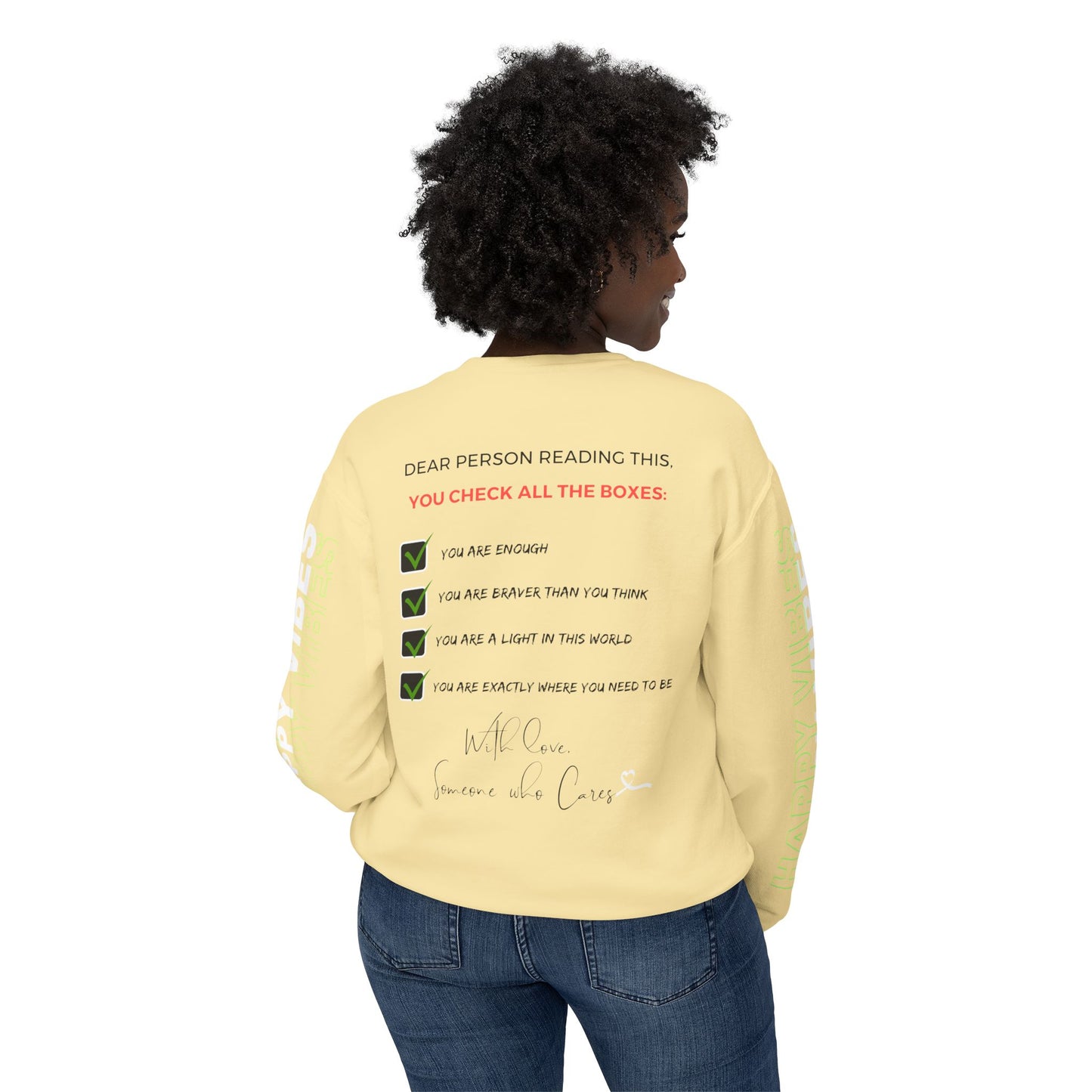 Woman showcasing the back of the Happy Vibes Unisex Sweatshirt with a checklist of positive affirmations. Butter Yellow color