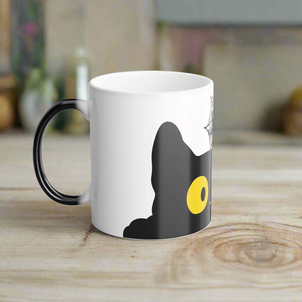 Magic morphing Halloween mug with black cat design on an white background, 11oz coffee cup
