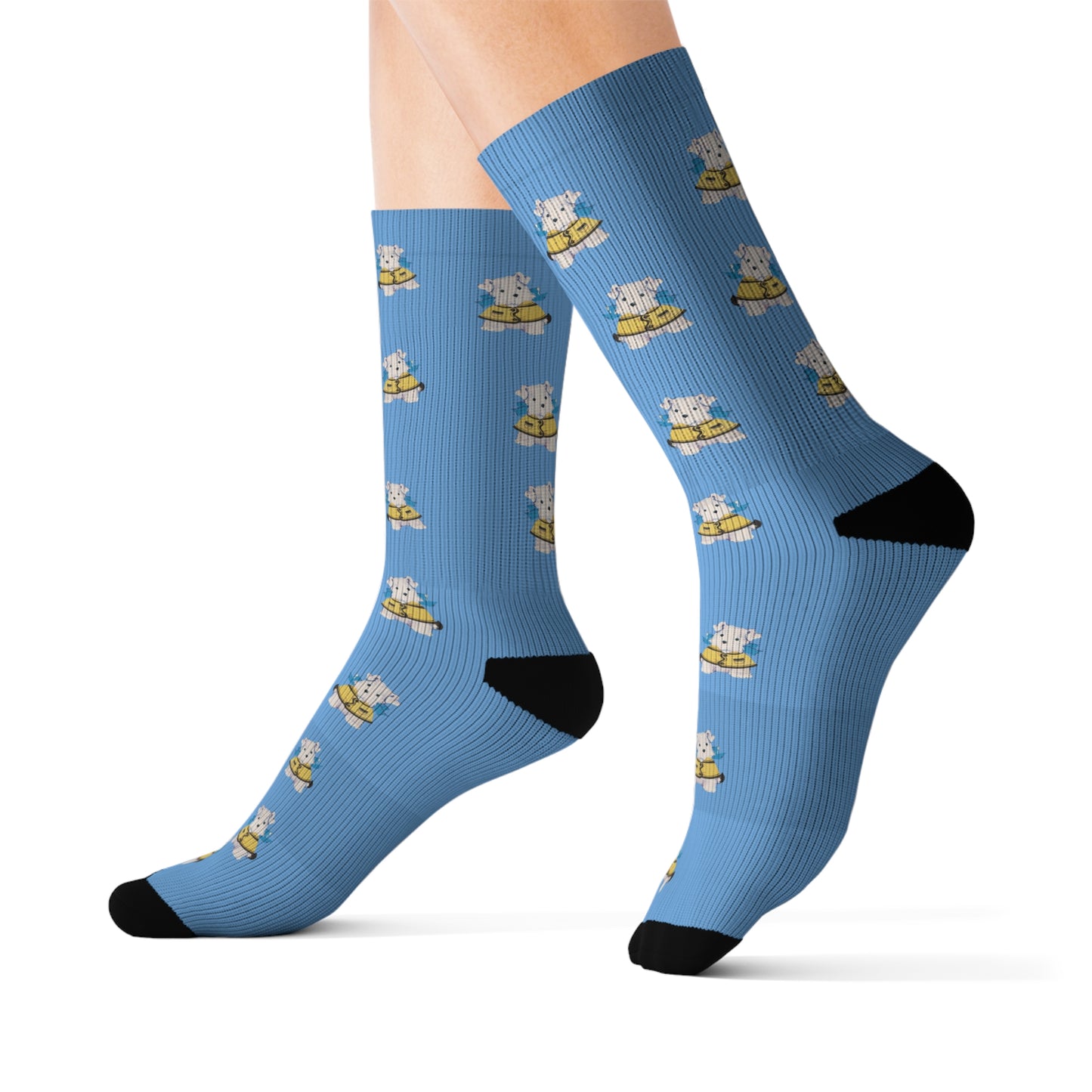 Close-up of the Bitsy puppy illustration on the socks, highlighting the yellow jacket and blue bow.