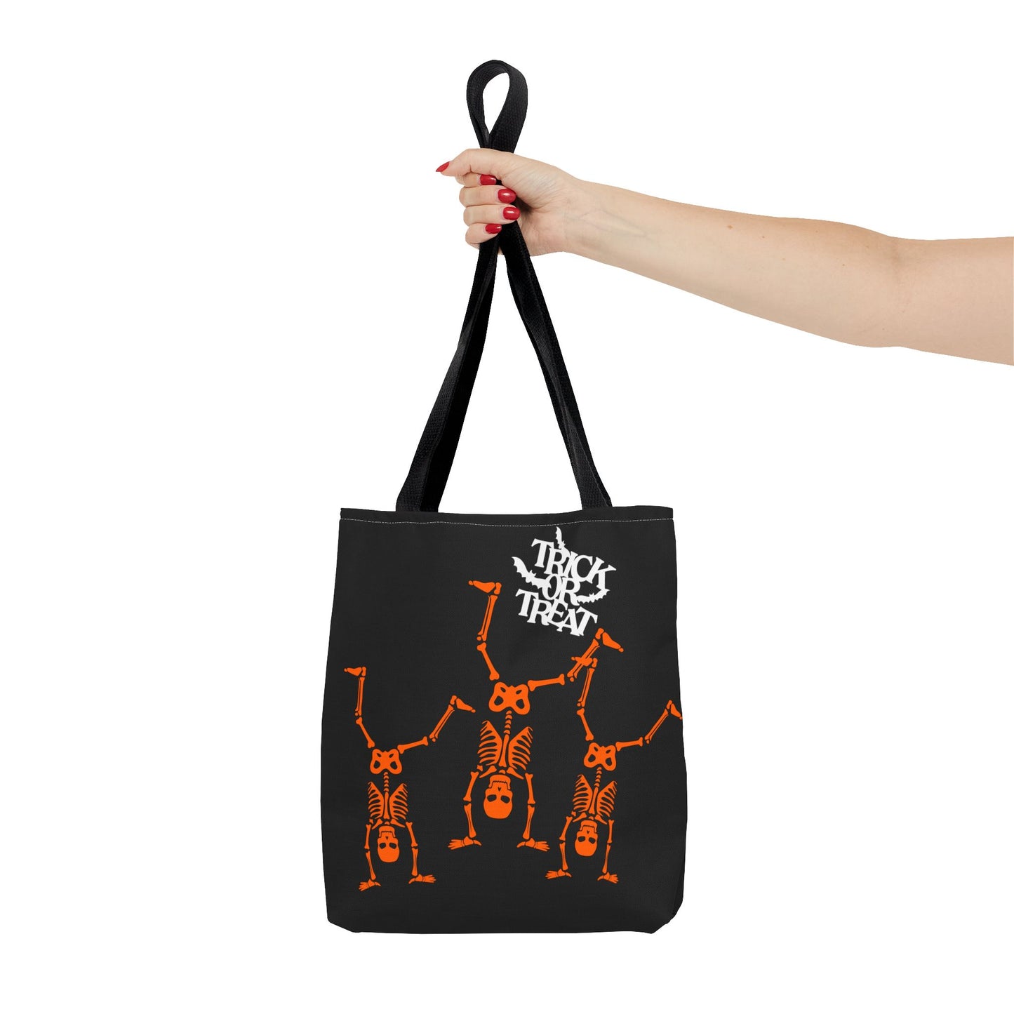 Close-up of Trick or Treat skeleton design on Halloween-themed tote bag.