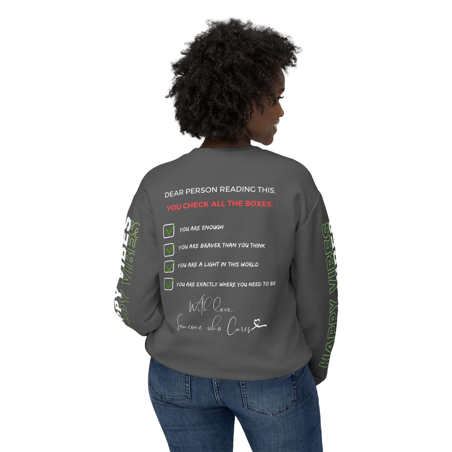 Back view of Woman wearing the Happy Vibes Unisex Sweatshirt with "You Are Worthy" text on front and "Happy Vibes" on sleeves. Pepper Color