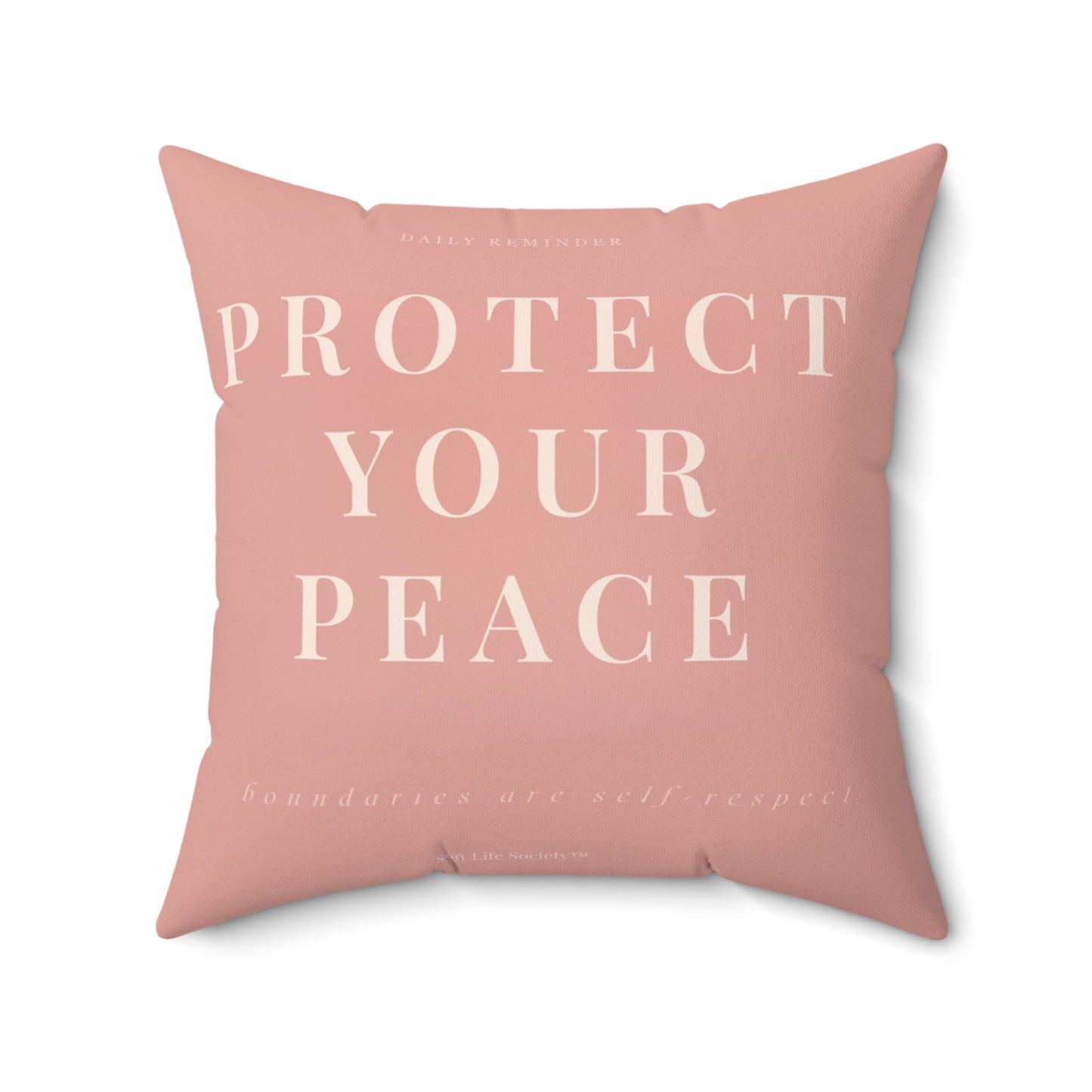 Pink pillow with 'Protect Your Peace' text on a white background