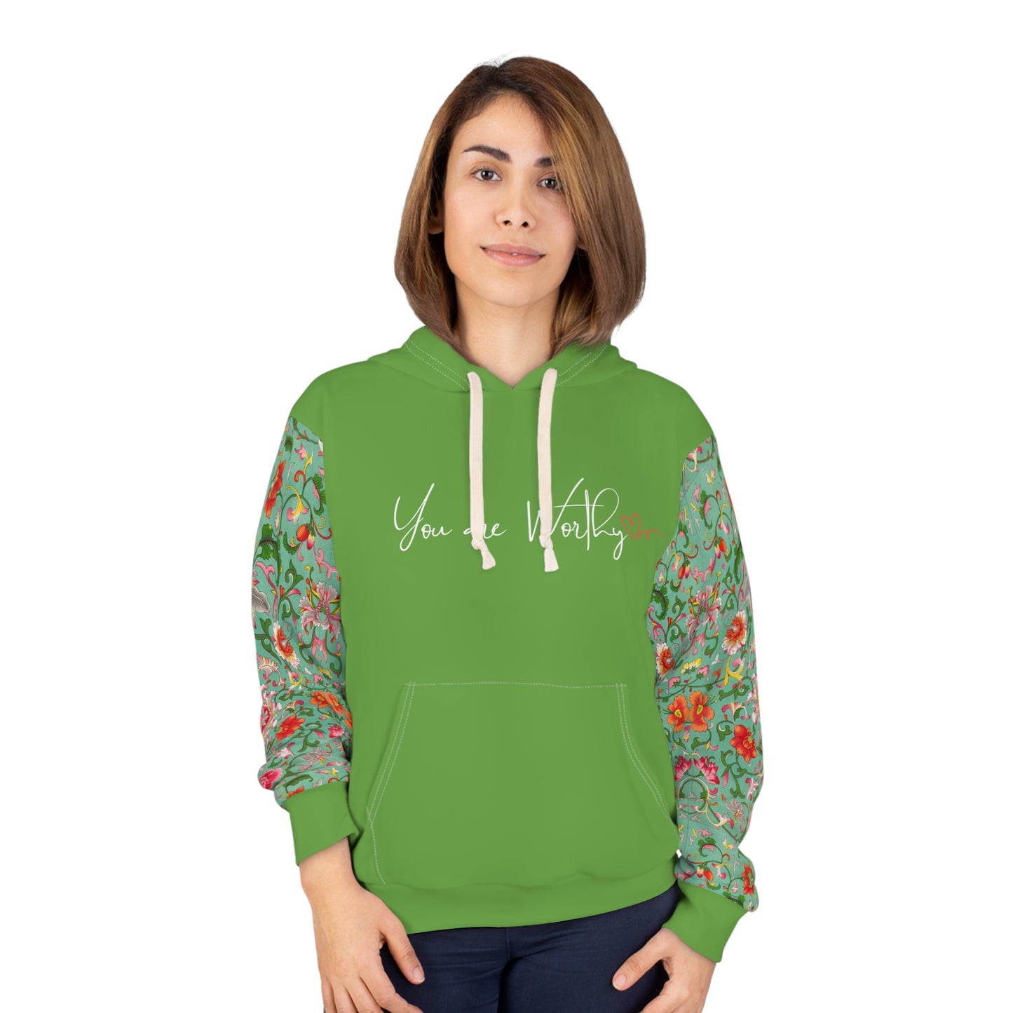 Woman wearing the inspirational floral hoodie, showing the front “You are Worthy” design and vibrant floral elements.
