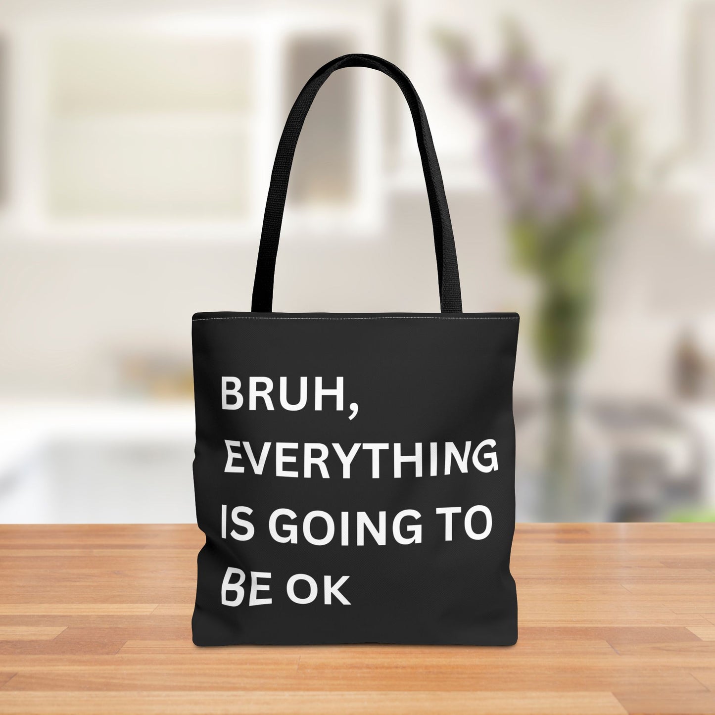 Front view of a minimalist tote bag featuring the quote "Bruh, Everything is Going to Be OK" in simple white text on a brown background.