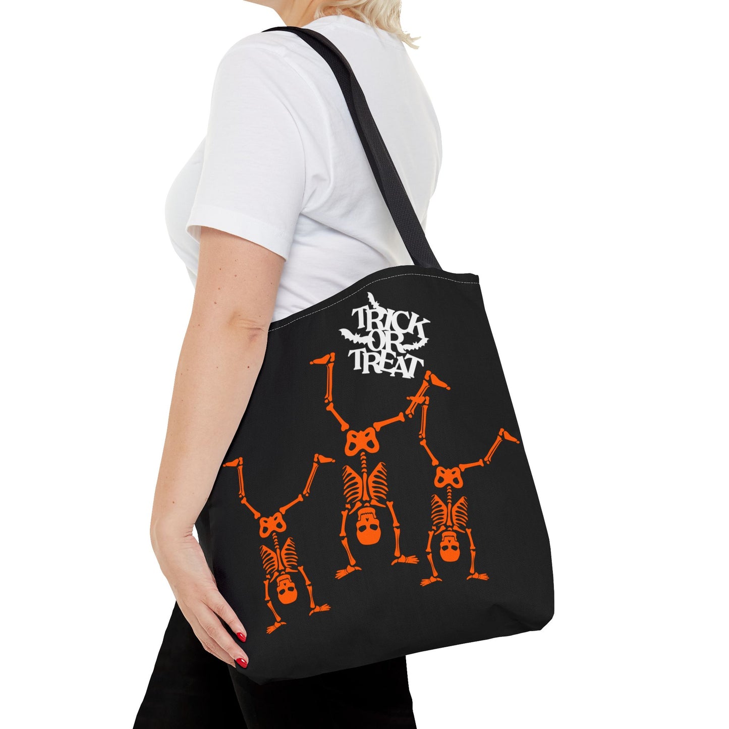 Close-up of Trick or Treat skeleton design on Halloween-themed tote bag.