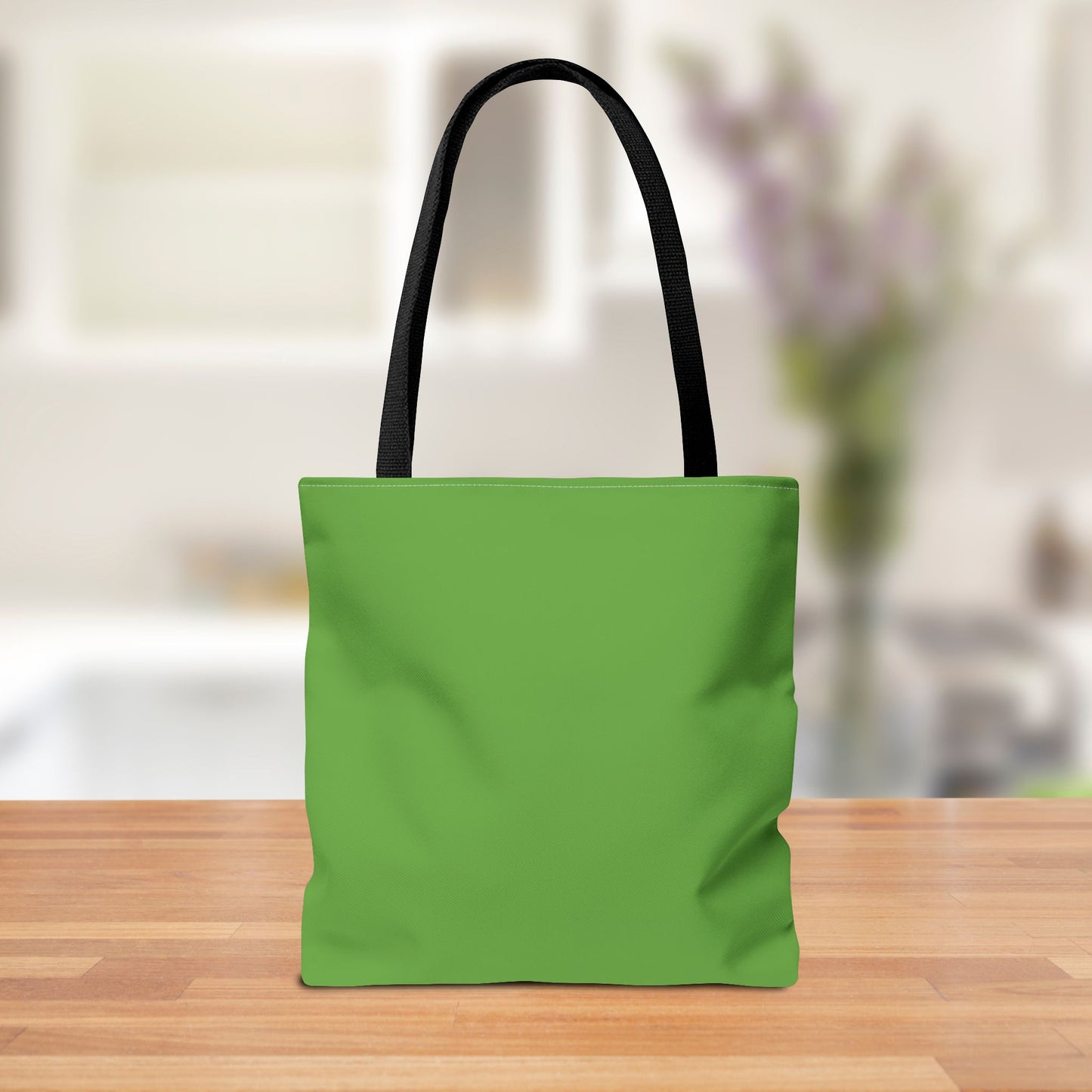 Back view of the tote bag showcasing the message in a simple, clean design.