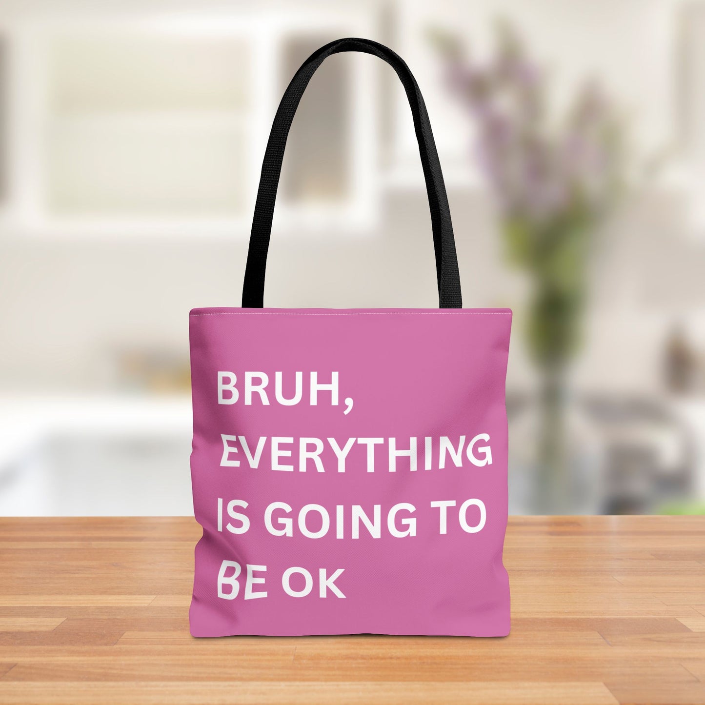 Front view of a minimalist tote bag featuring the quote "Bruh, Everything is Going to Be OK" in simple white text on a brown background.