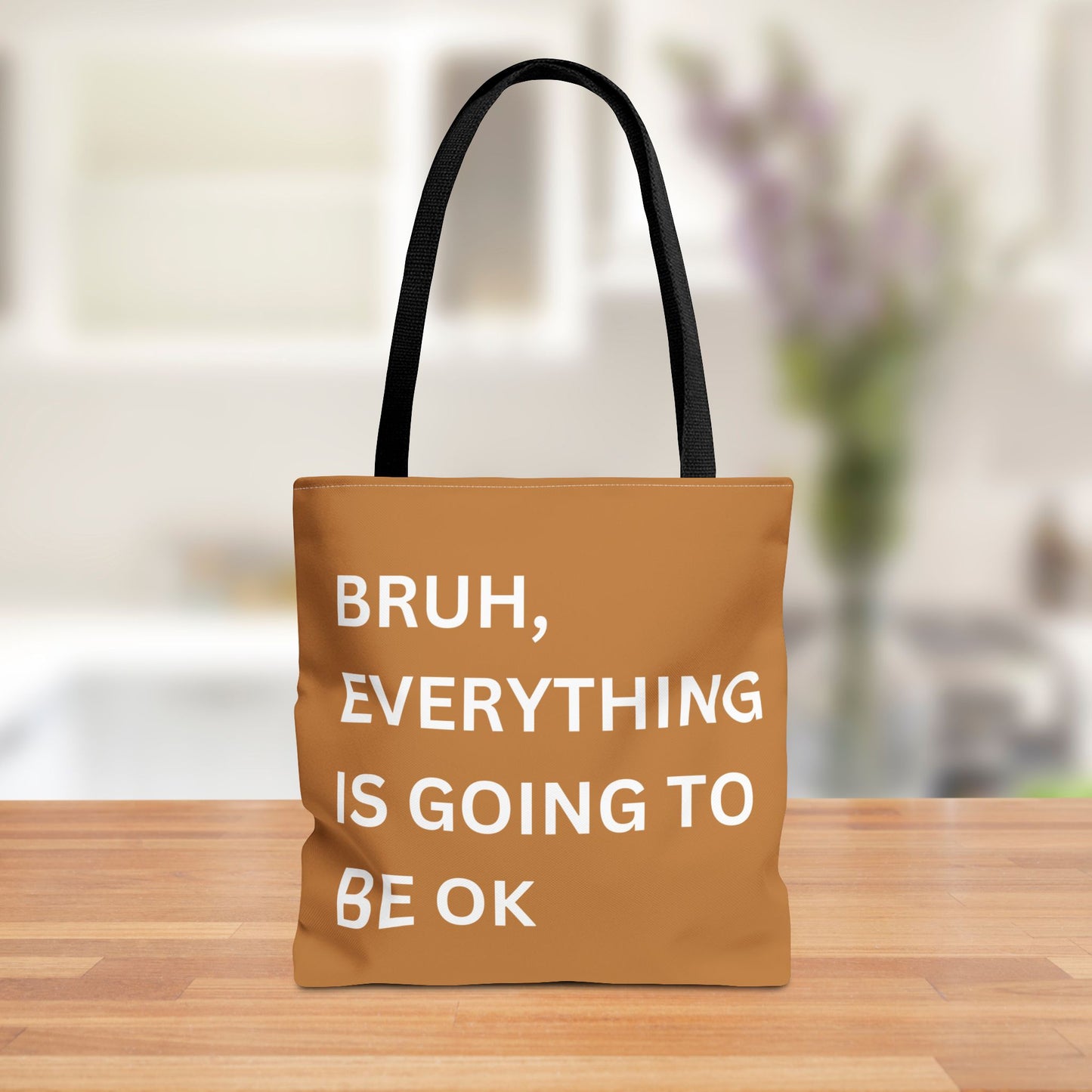 Front view of a minimalist tote bag featuring the quote "Bruh, Everything is Going to Be OK" in simple white text on a brown background.