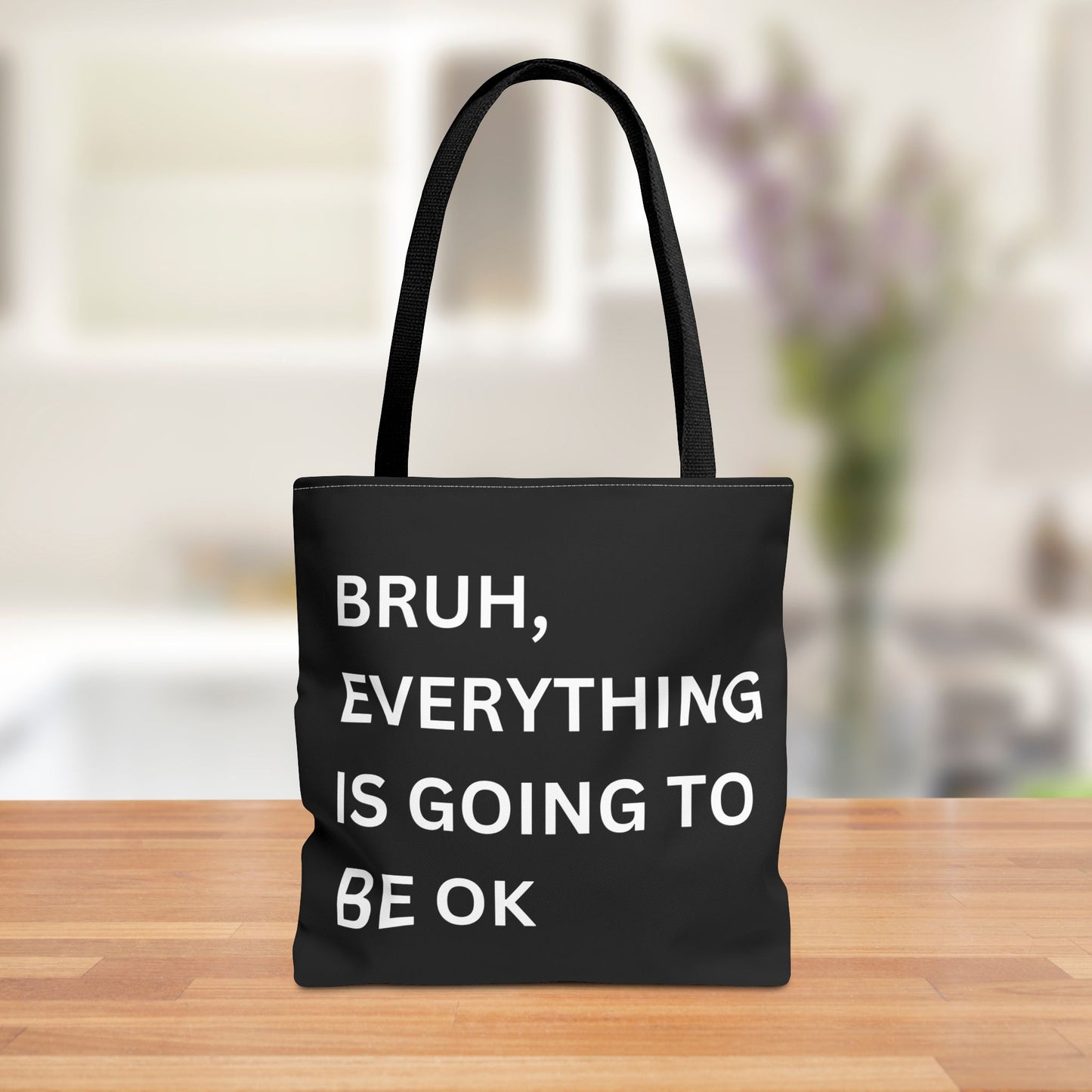 Front view of a minimalist tote bag featuring the quote "Bruh, Everything is Going to Be OK" in simple white text on a brown background.
