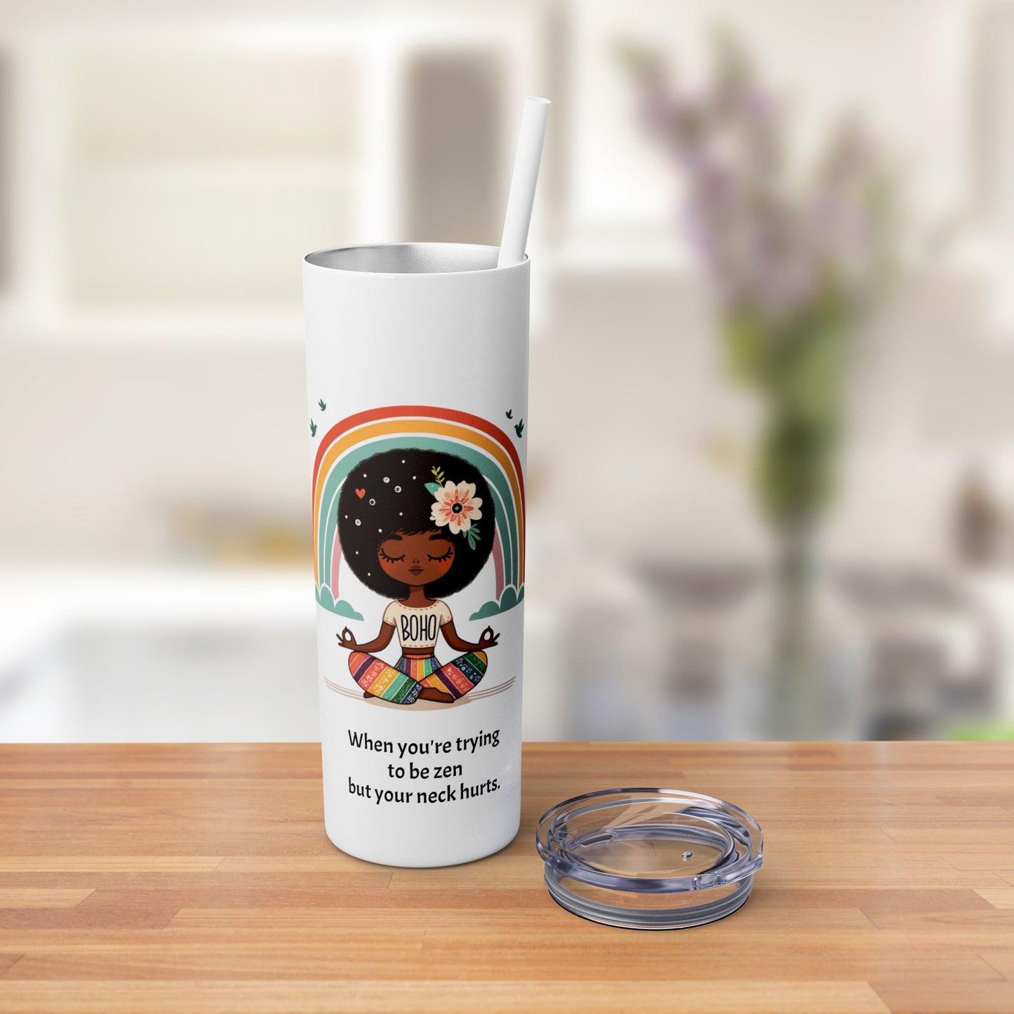 Close-up of the Zen Meditating Tumbler's lid, featuring the included straw for easy sipping.