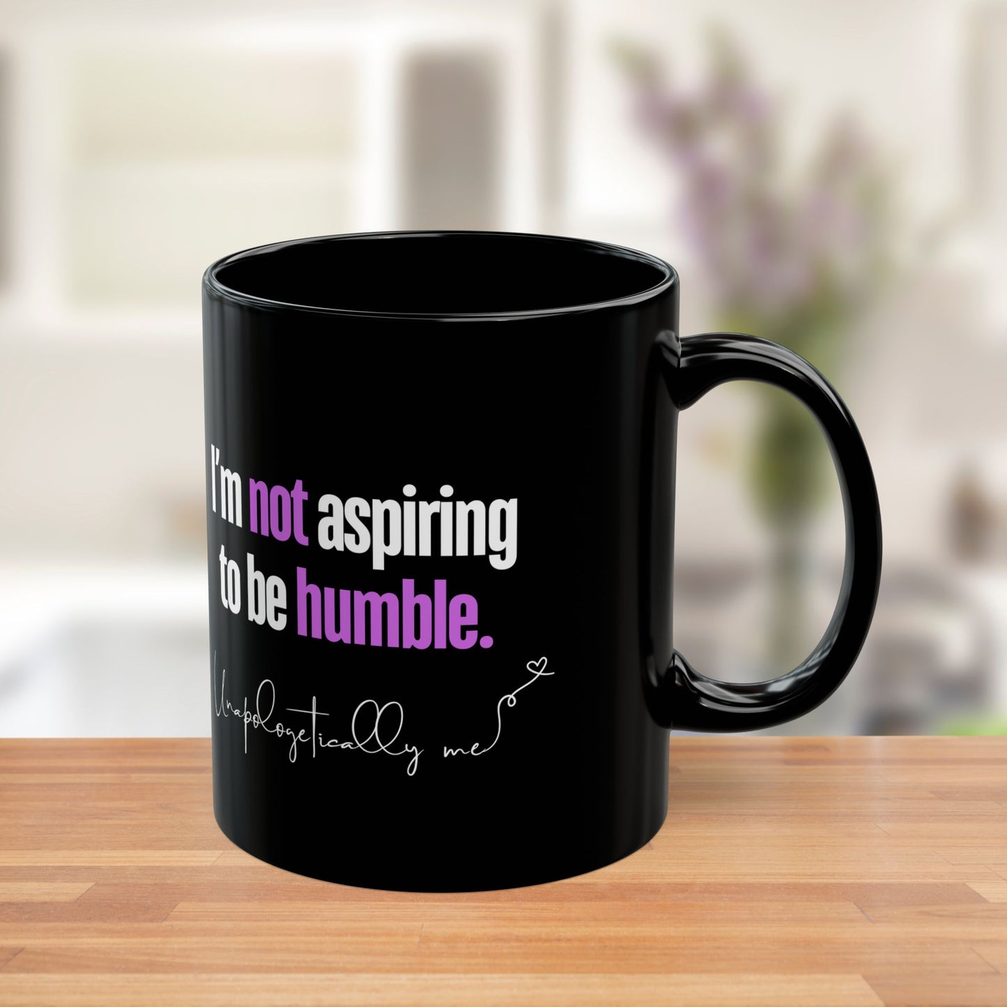 Side view of the mug showing the purple accents on "not" and "humble."