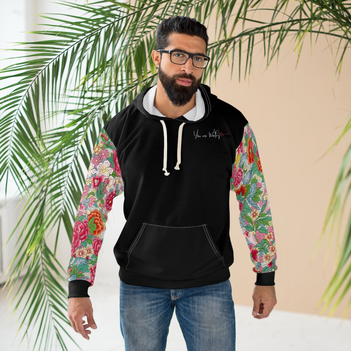 Man wearing the 'You Are Worthy' hoodie, showing the motivational message and floral print design for a stylish, casual look.