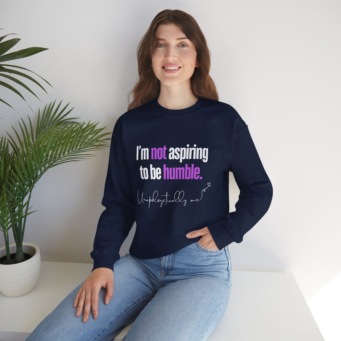 Model wearing the sweatshirt, illustrating how it can be styled casually with jeans.