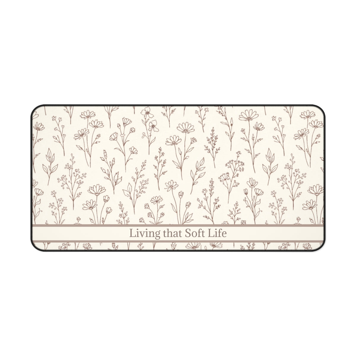 Rectangular desk mat with floral pattern and 'Living that Soft Life' text on a white background