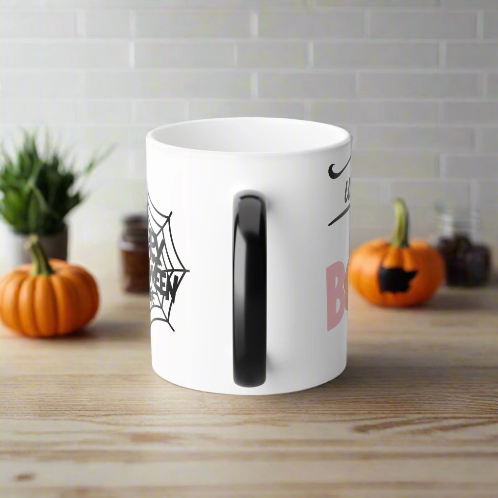 Back view of Wicked Cute Halloween Boo Magic Morphing Mug with a white background, featuring a cute ghost in an orange beanie holding a pumpkin-themed drink, and a pumpkin on the side