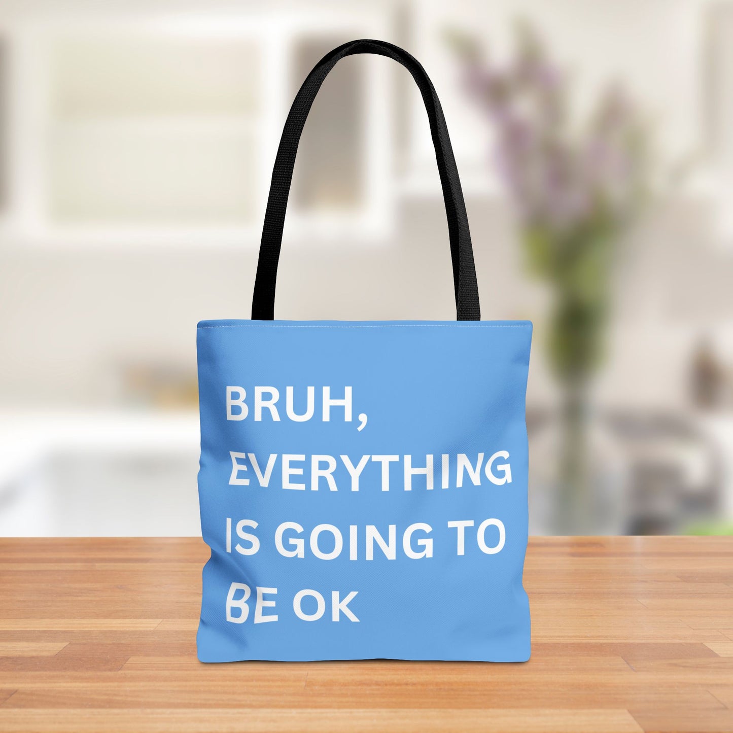 Front view of a minimalist tote bag featuring the quote "Bruh, Everything is Going to Be OK" in simple white text on a brown background.