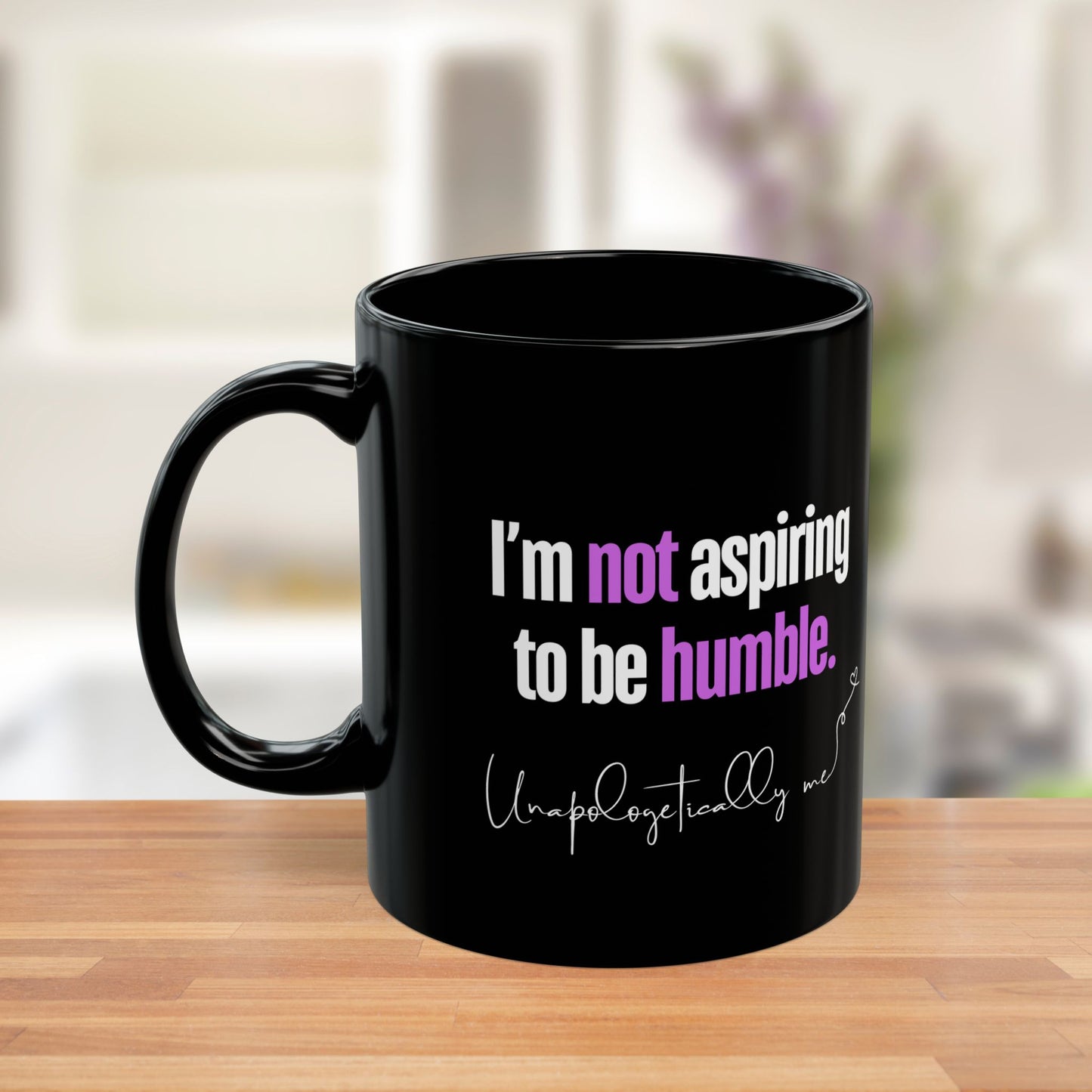 Side view of the mug showing the purple accents on "not" and "humble."