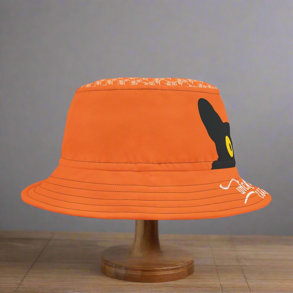 Side view of the Wicked Cute Black Cat Halloween Bucket Hat with a solid orange design and visible stitching.