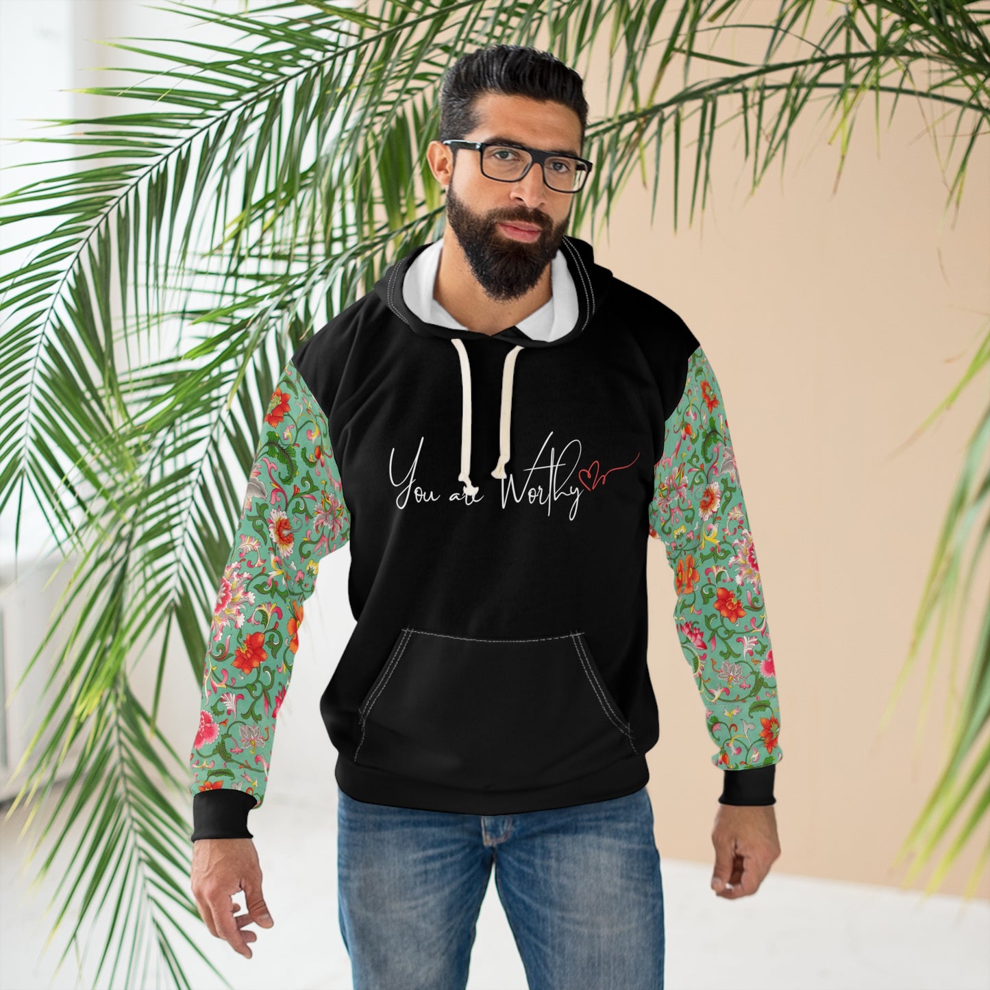 Man wearing the 'You Are Worthy' hoodie, showing the motivational message and floral print design for a stylish, casual look.