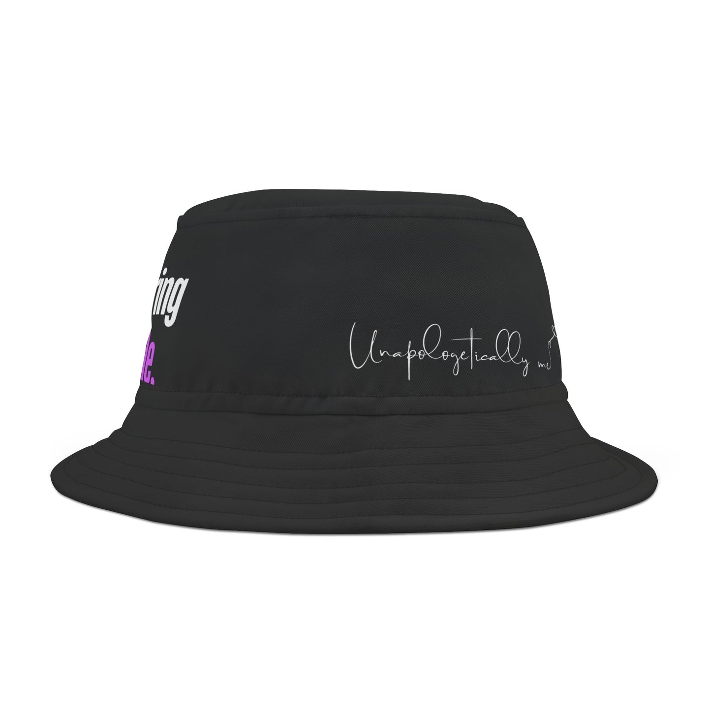 Side view of the black bucket hat with the phrase “Unapologetically me” printed in bold.
