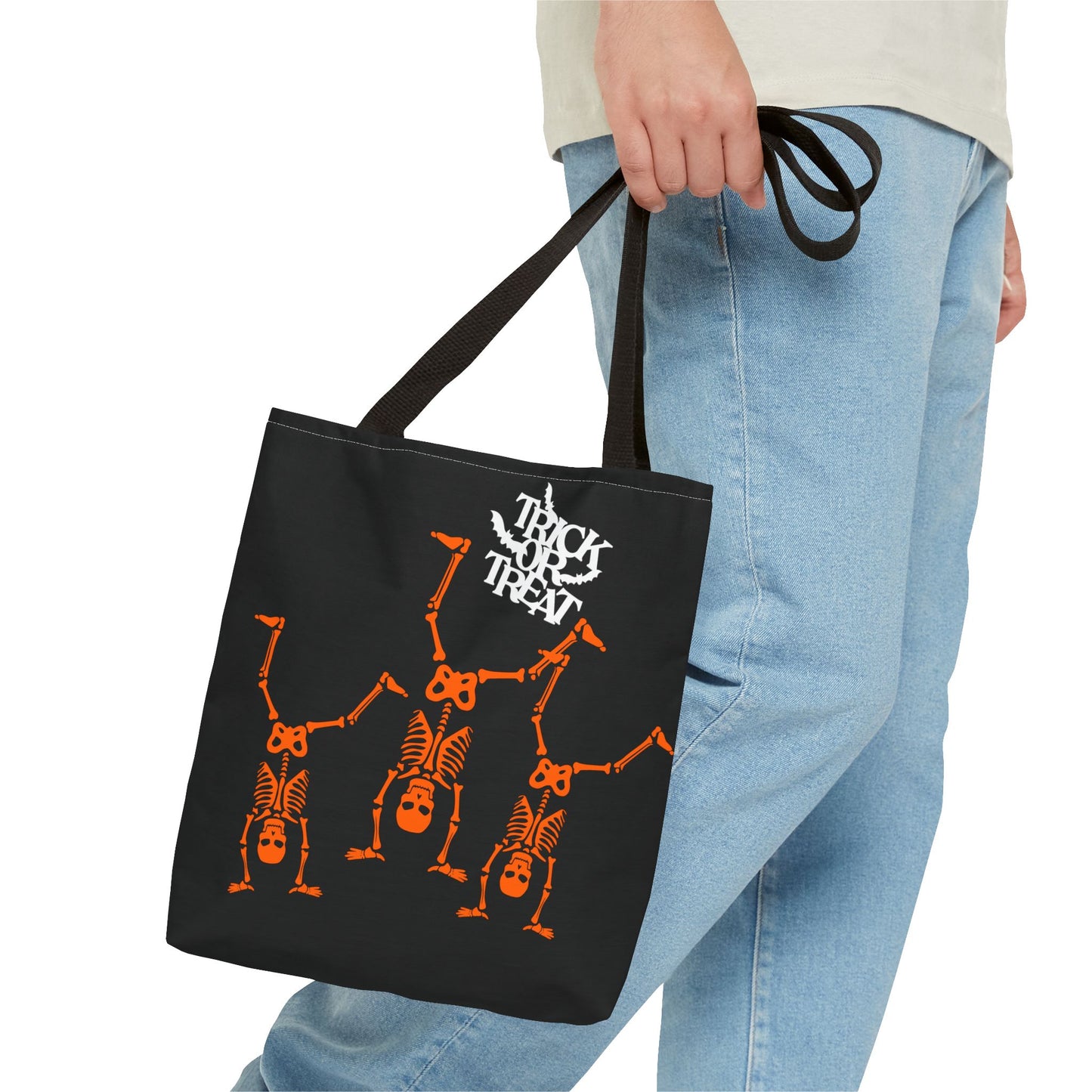 Close-up of Trick or Treat skeleton design on Halloween-themed tote bag.