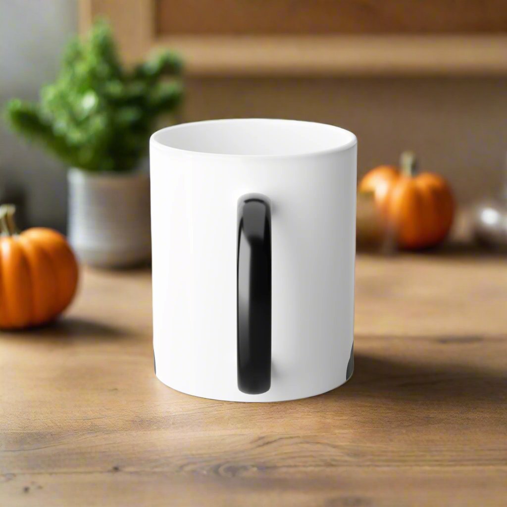 Magic morphing Halloween mug with black cat design on an white background, 11oz coffee cup