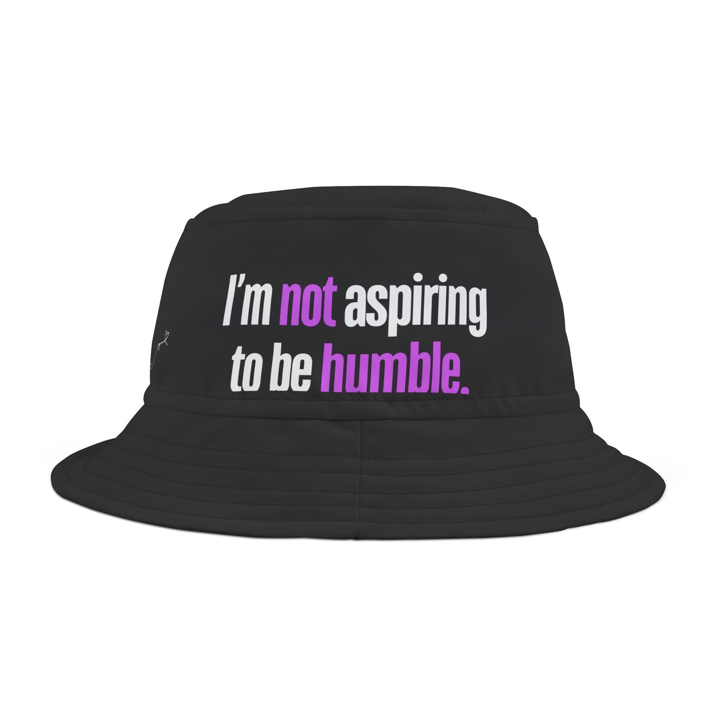 Front view of the black bucket hat with the phrase “I’m not aspiring to be humble” printed in bold.