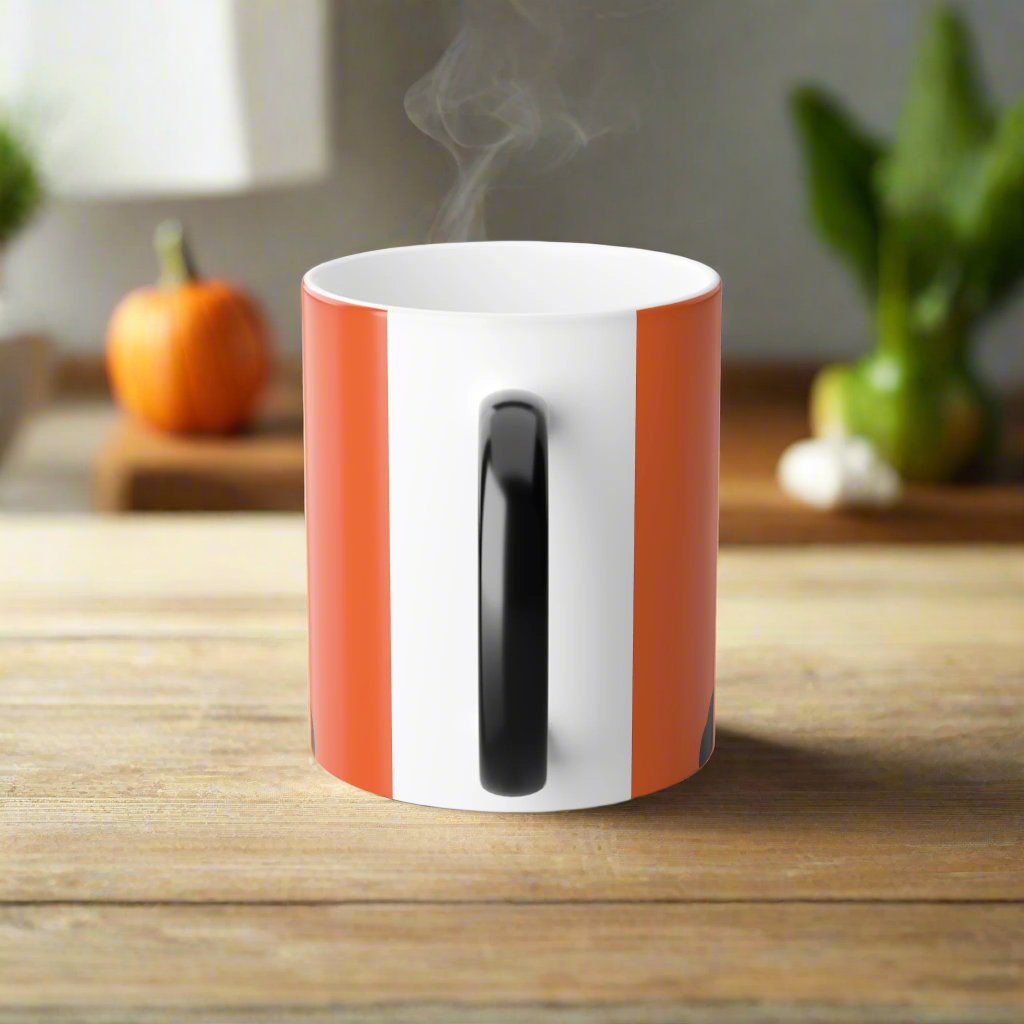 Magic morphing Halloween mug with black cat design on an orange background, 11oz coffee cup