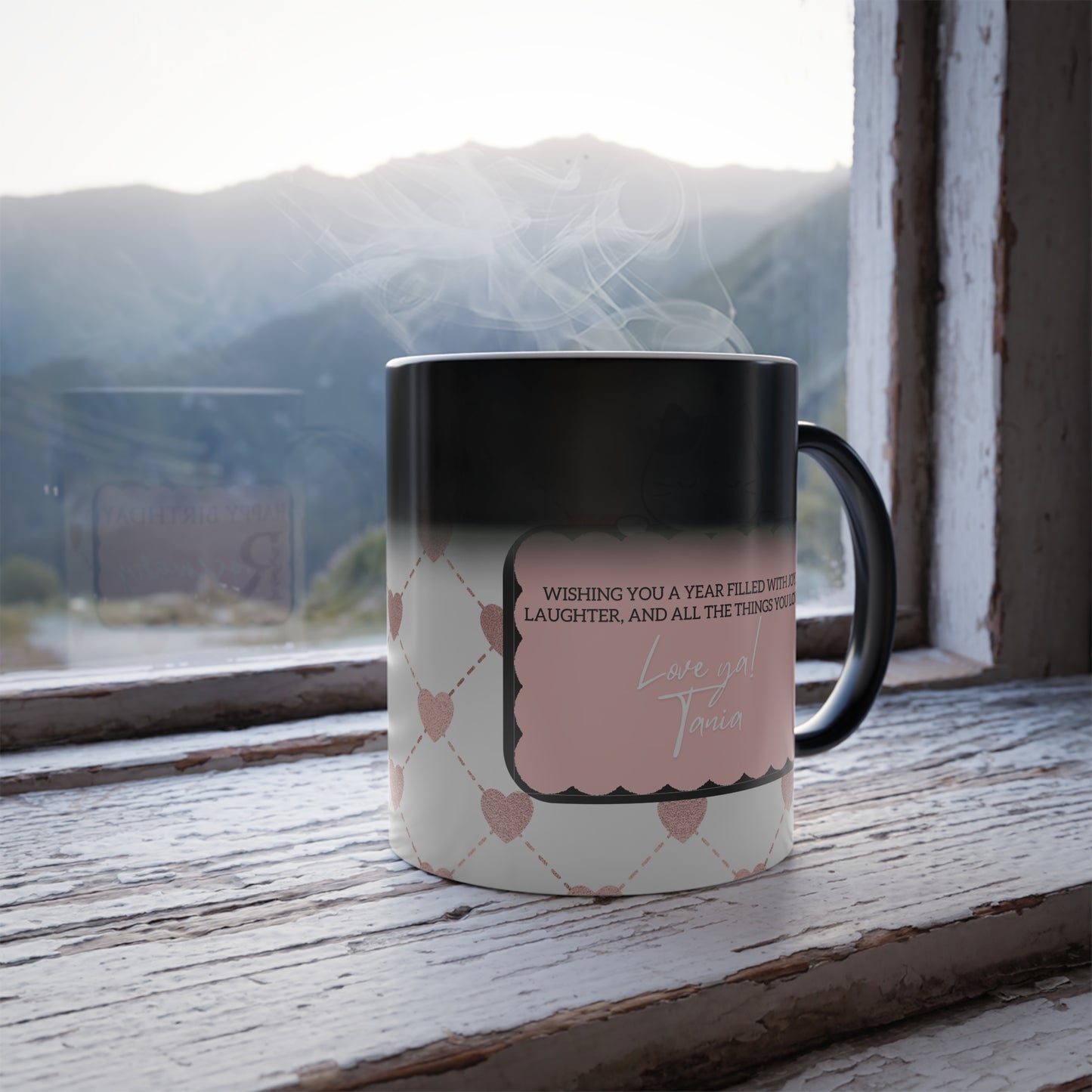 Magic morphing mug revealing personalized message and cute cat design as it heats up.