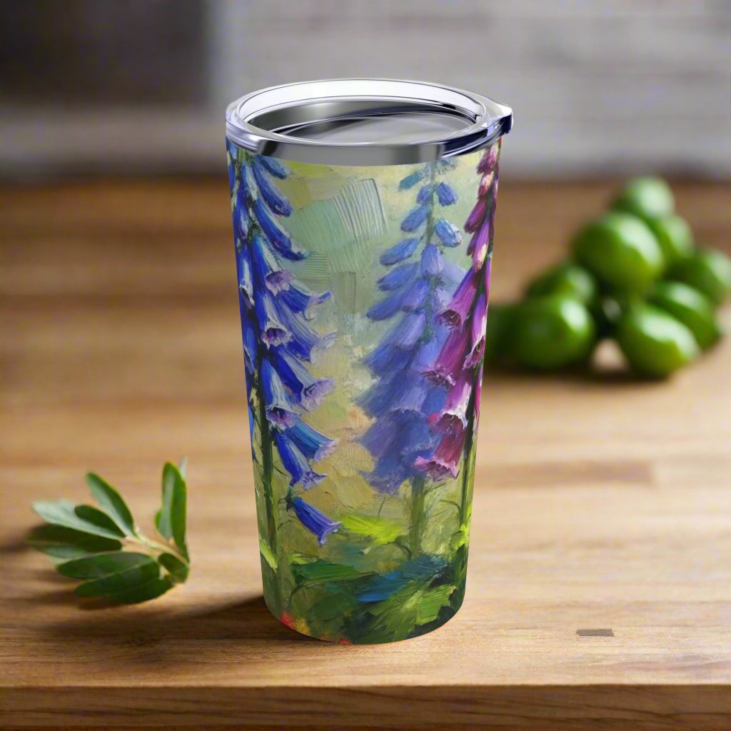 Right side view of the 20oz stainless steel tumbler displaying the continuation of the bluebird and nature-inspired artwork.