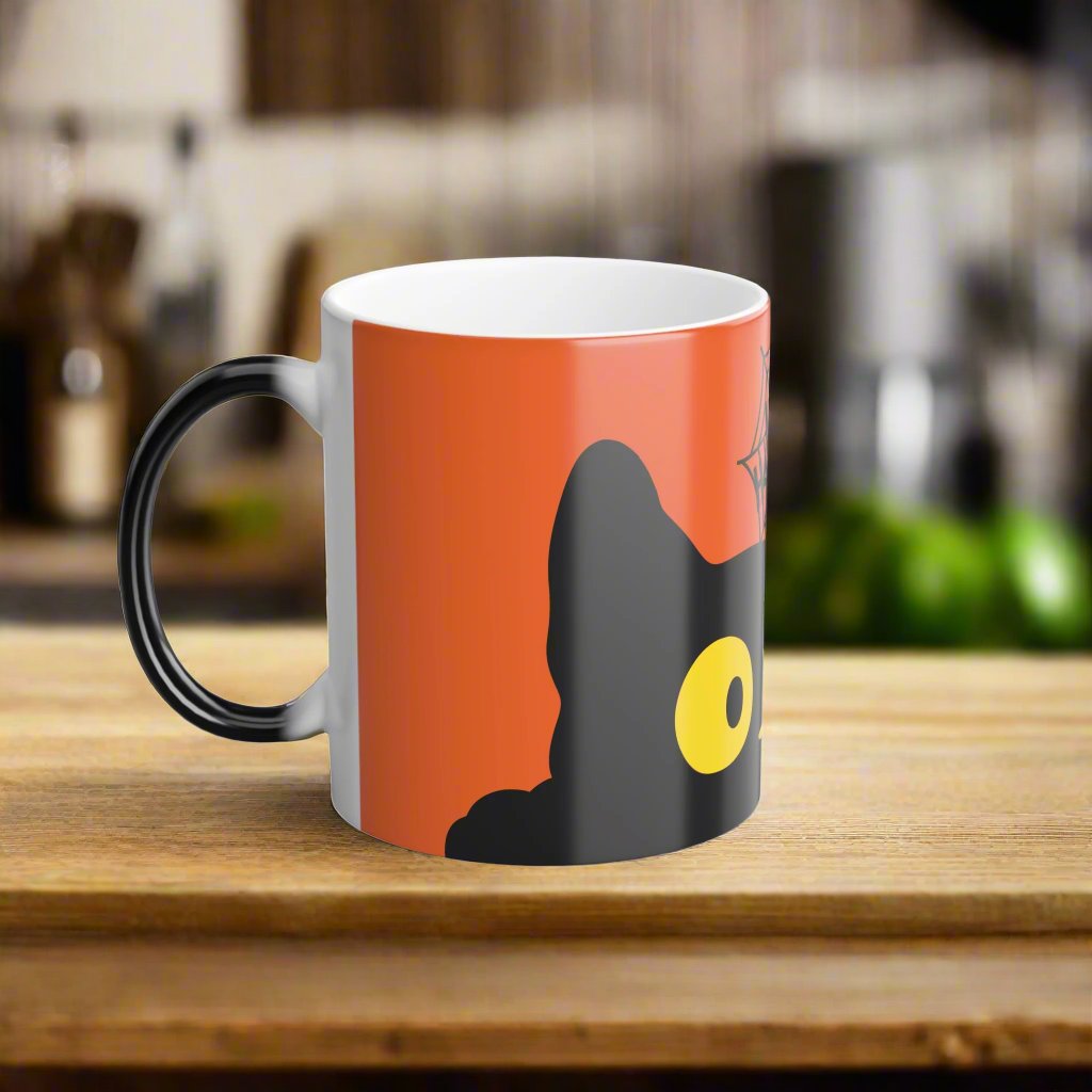 Magic morphing Halloween mug with black cat design on an orange background, 11oz coffee cup
