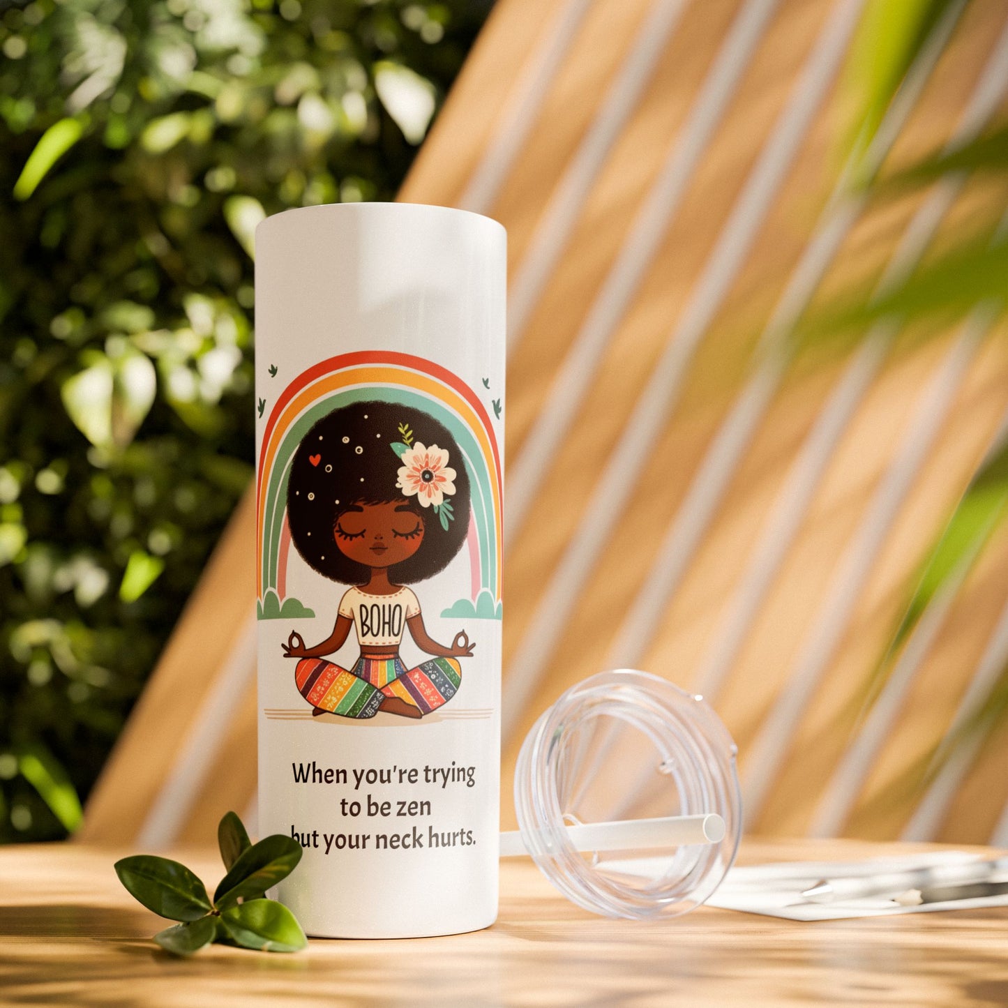 Close-up of the Zen Meditating Tumbler's lid, featuring the included straw for easy sipping.
