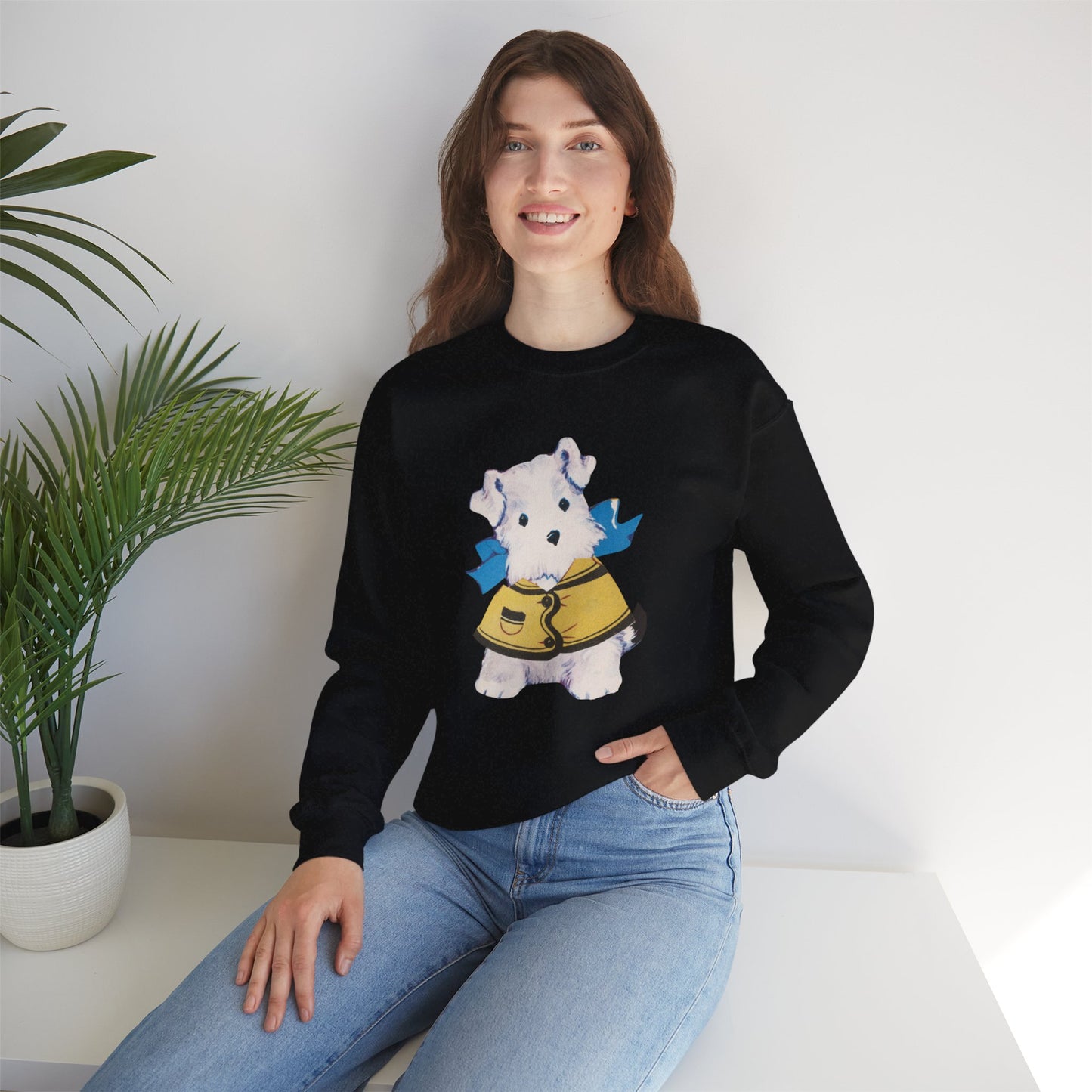 Black sweatshirt featuring a front illustration of Bitsy, the vintage paper doll dog, with a yellow jacket and blue bow.