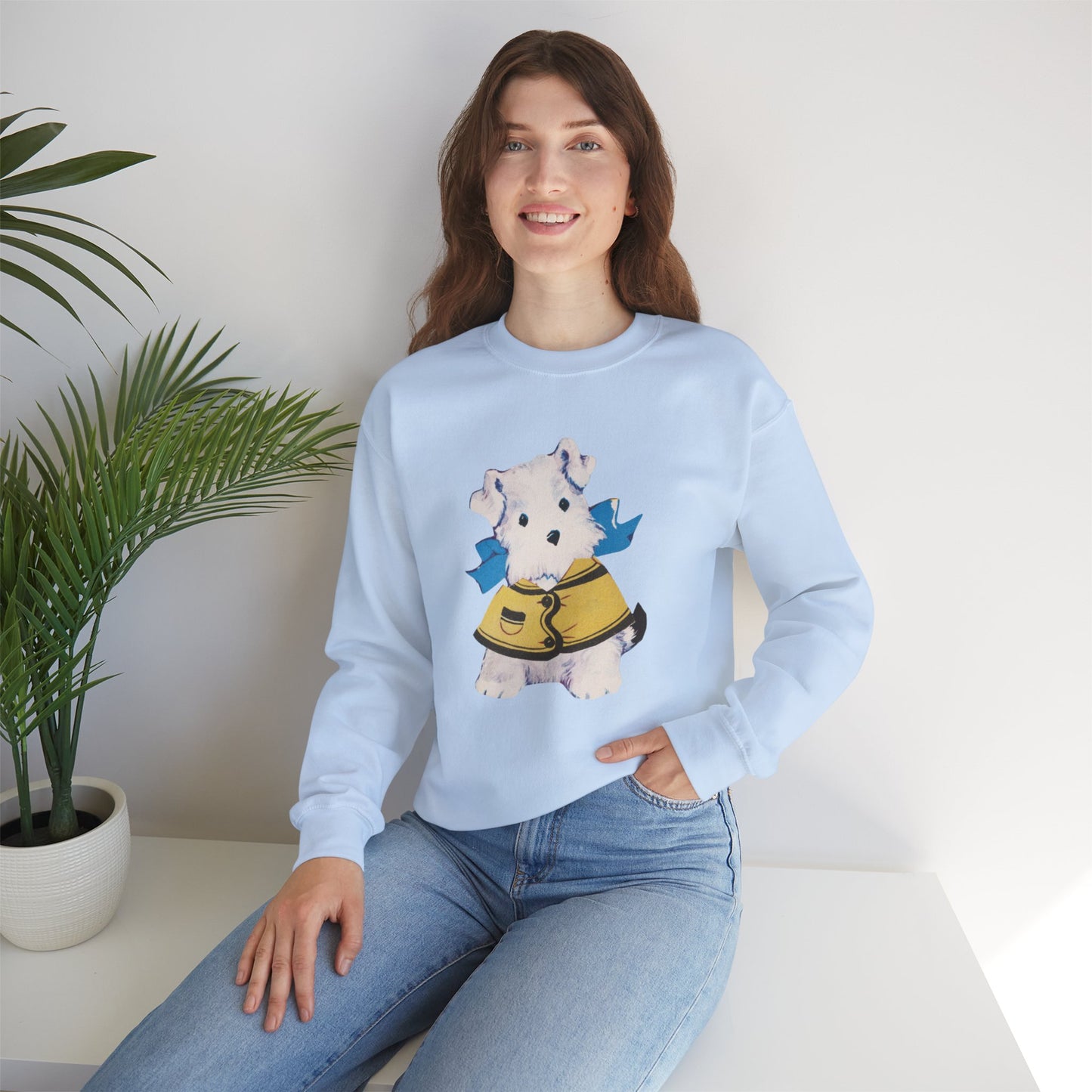 Light blue sweatshirt showcasing the vintage Bitsy puppy design, complete with a yellow jacket and blue bow.
