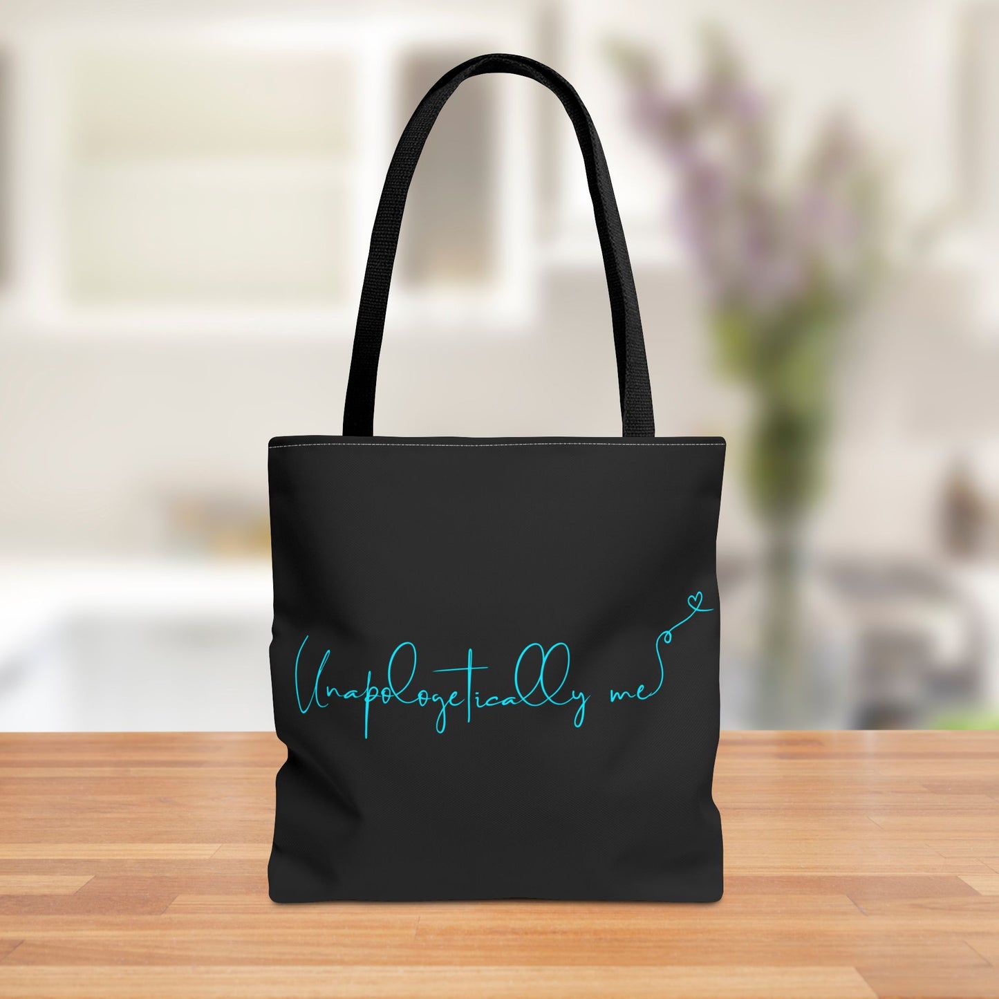 Front view of the Unapologetically Me tote bag with bold teal design.