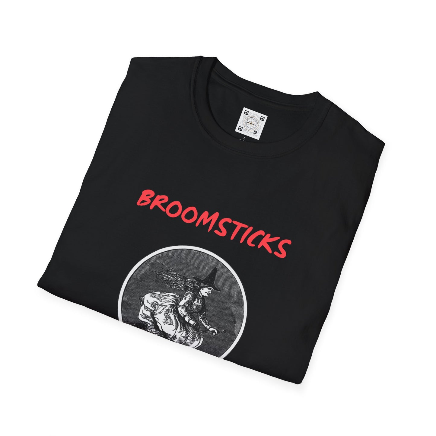 Folded black t-shirt featuring a vintage witch illustration and the text 'Broomsticks: The Original Eco-Friendly Ride.' This eco-conscious apparel is perfect for Halloween and sustainable fashion lovers.