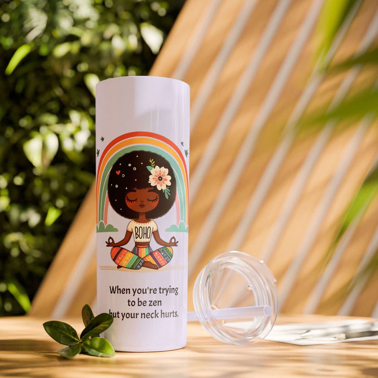 Close-up of the Zen Meditating Tumbler's lid, featuring the included straw for easy sipping.