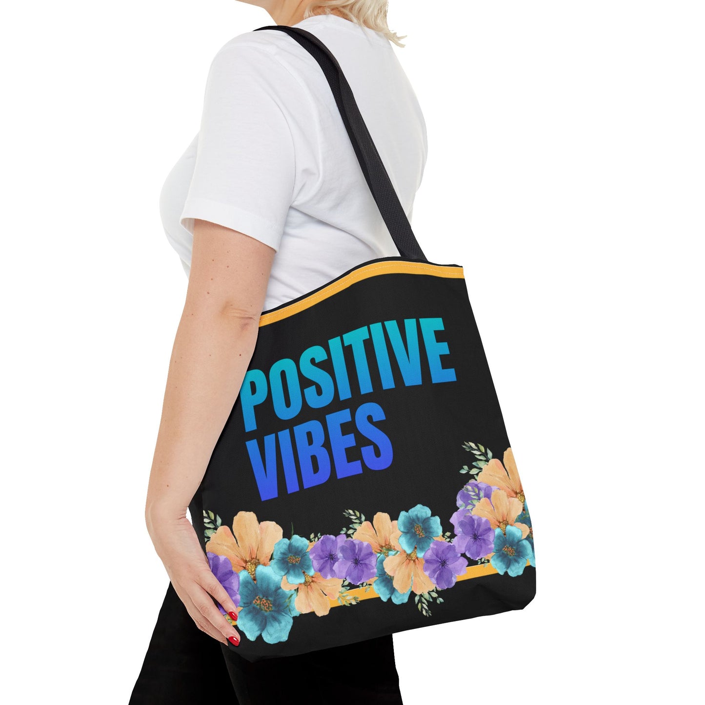 Close-up of floral design and motivational quote on Positive Vibes tote bag.