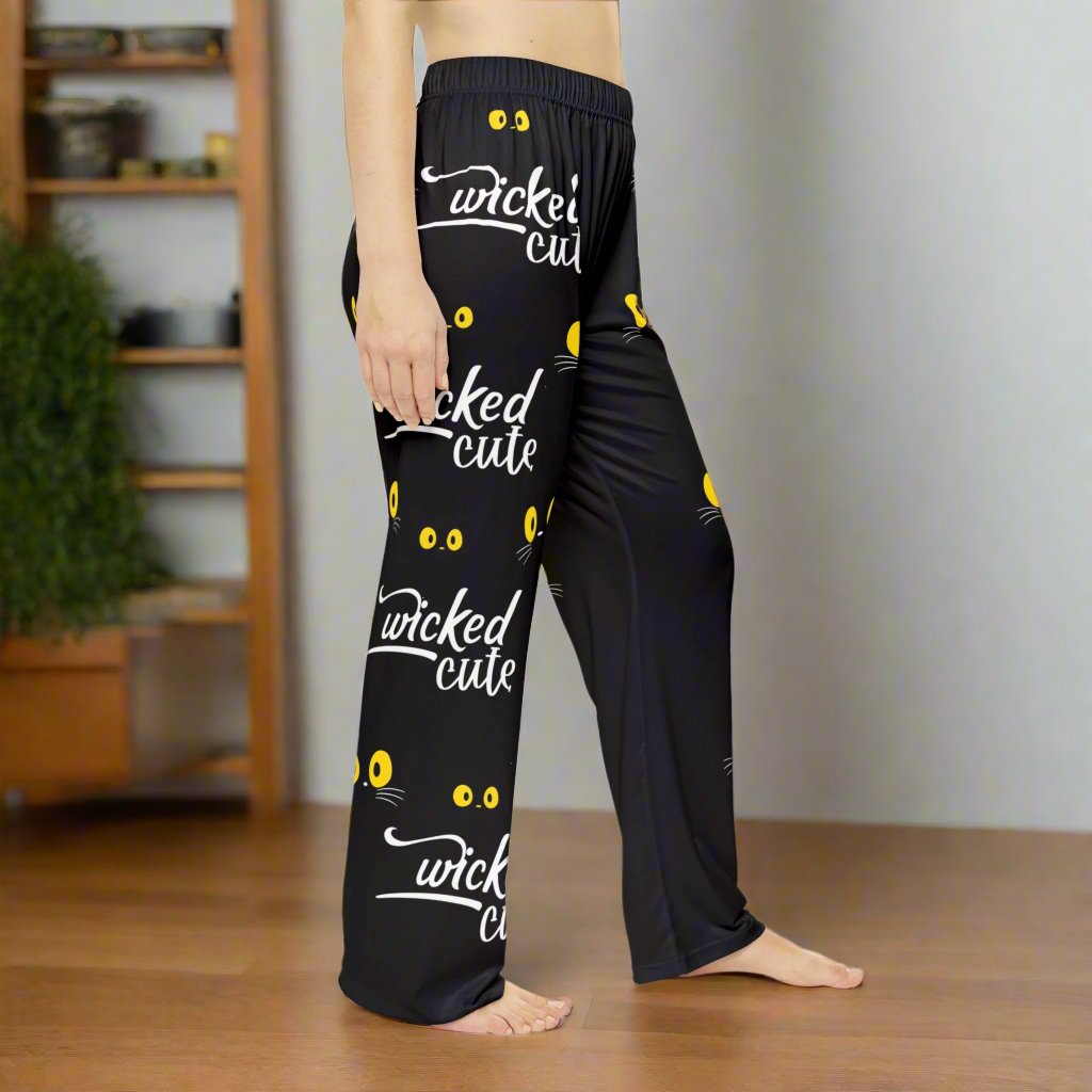 Right side view of Wicked Cute Black Cat Women's Pajama Pants highlighting the consistent all-over print design with yellow cat eyes and Wicked Cute text