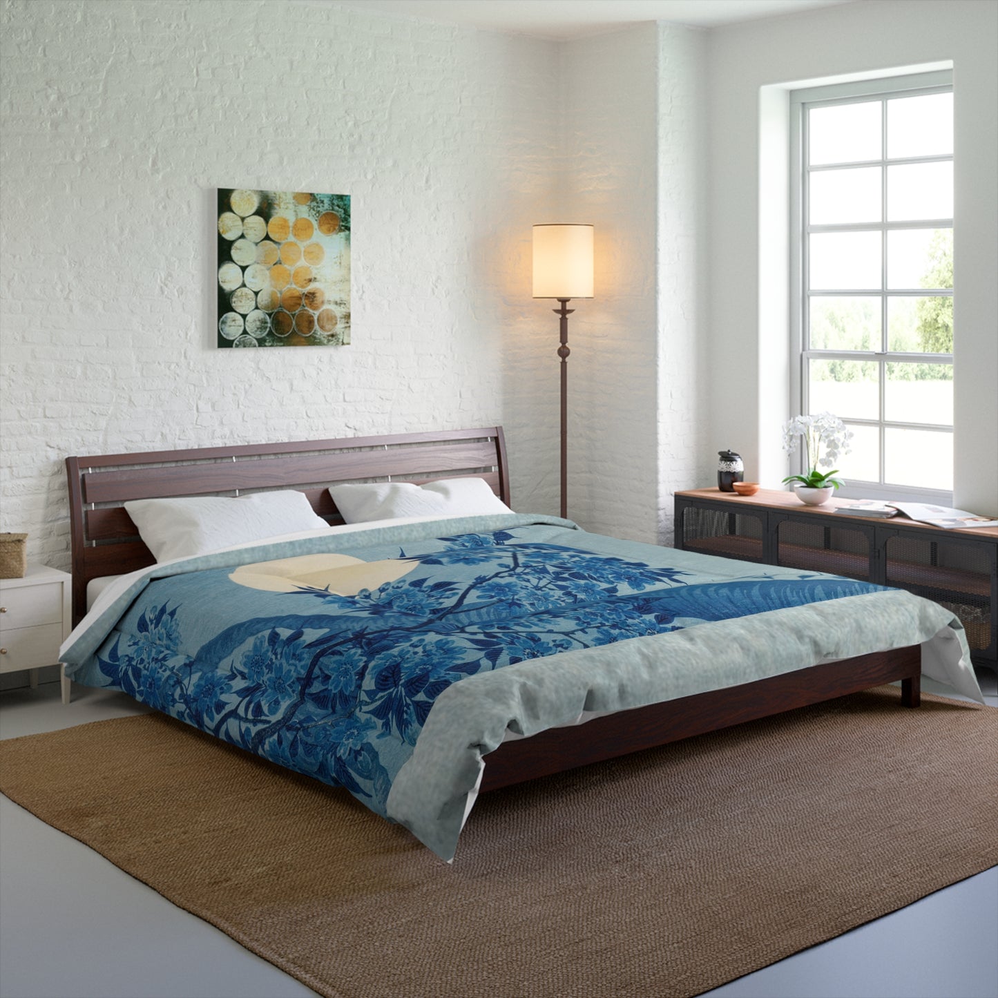 Blanket styled on a king-sized bed with matching décor in a modern, well-lit bedroom.