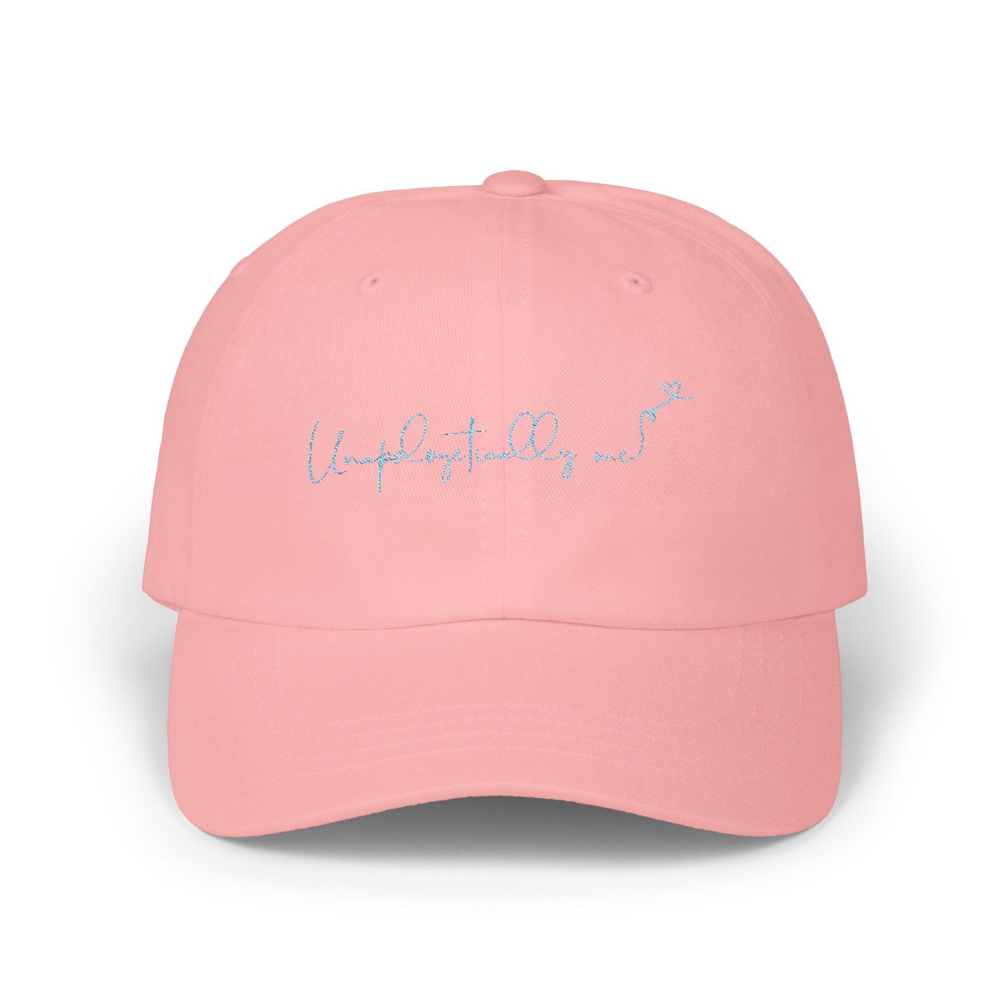 Front view of the 'Unapologetically Me' Classic Dad Hat in pink, showcasing the embroidered design on a clean, minimalist base.