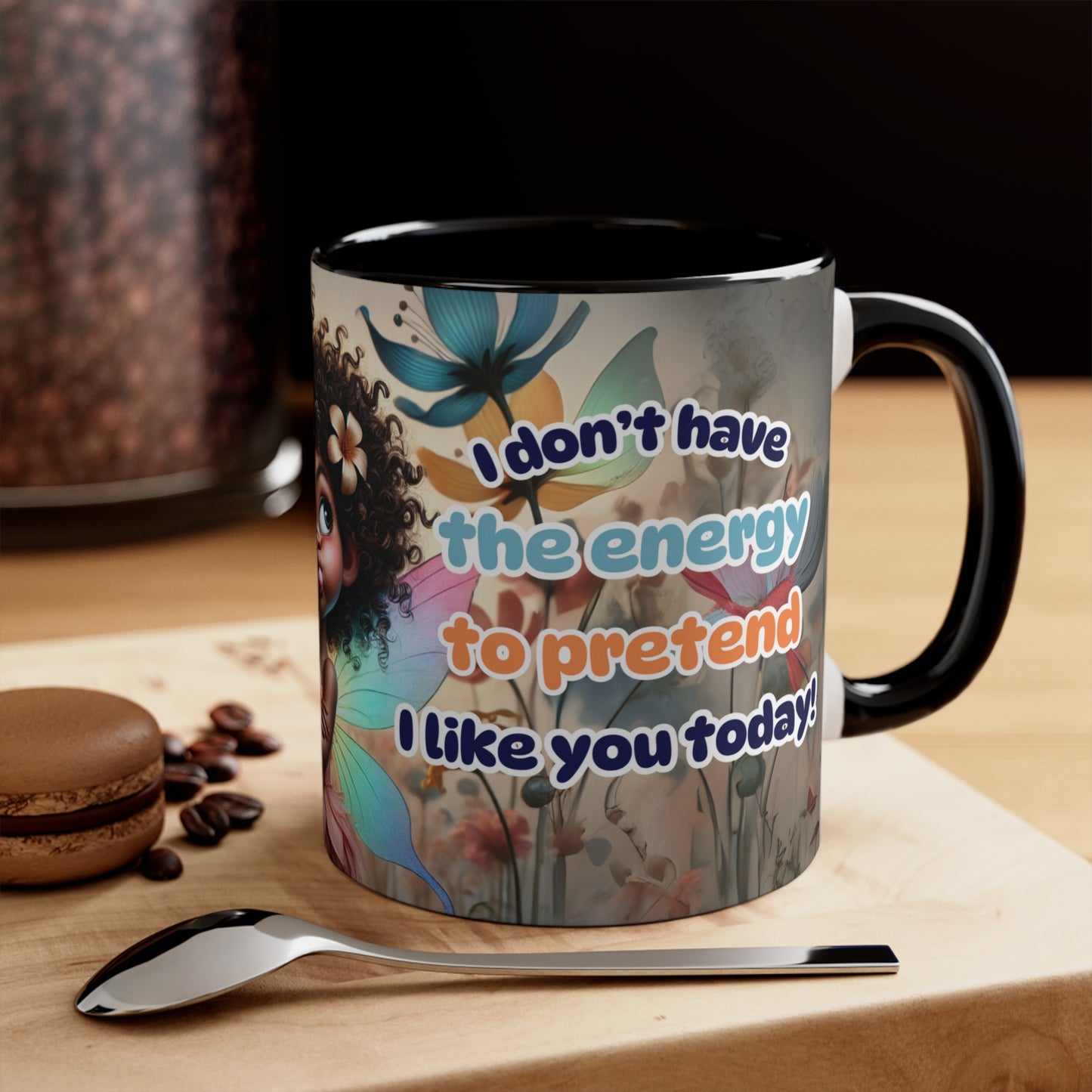 Playful and sassy coffee mug displayed on a wooden counter with coffee beans and a spoon.