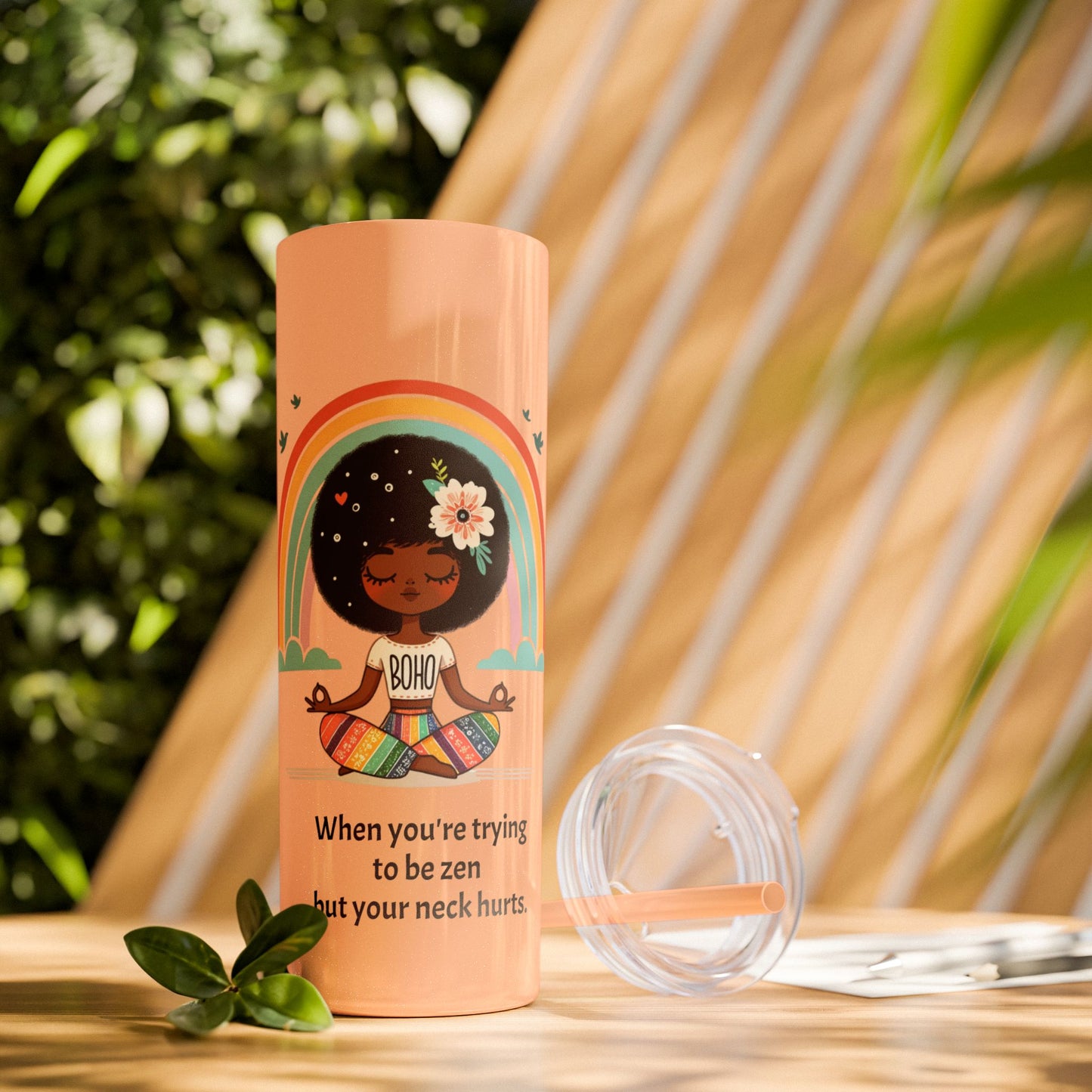 Close-up of the Zen Meditating Tumbler's lid, featuring the included straw for easy sipping.