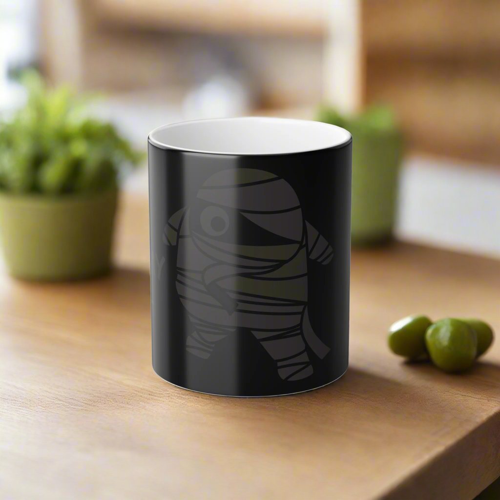 Mummy Fuel Heat-Activated Magic Morphing Mug, 11oz, featuring a Halloween-themed Mummy design that changes color with heat