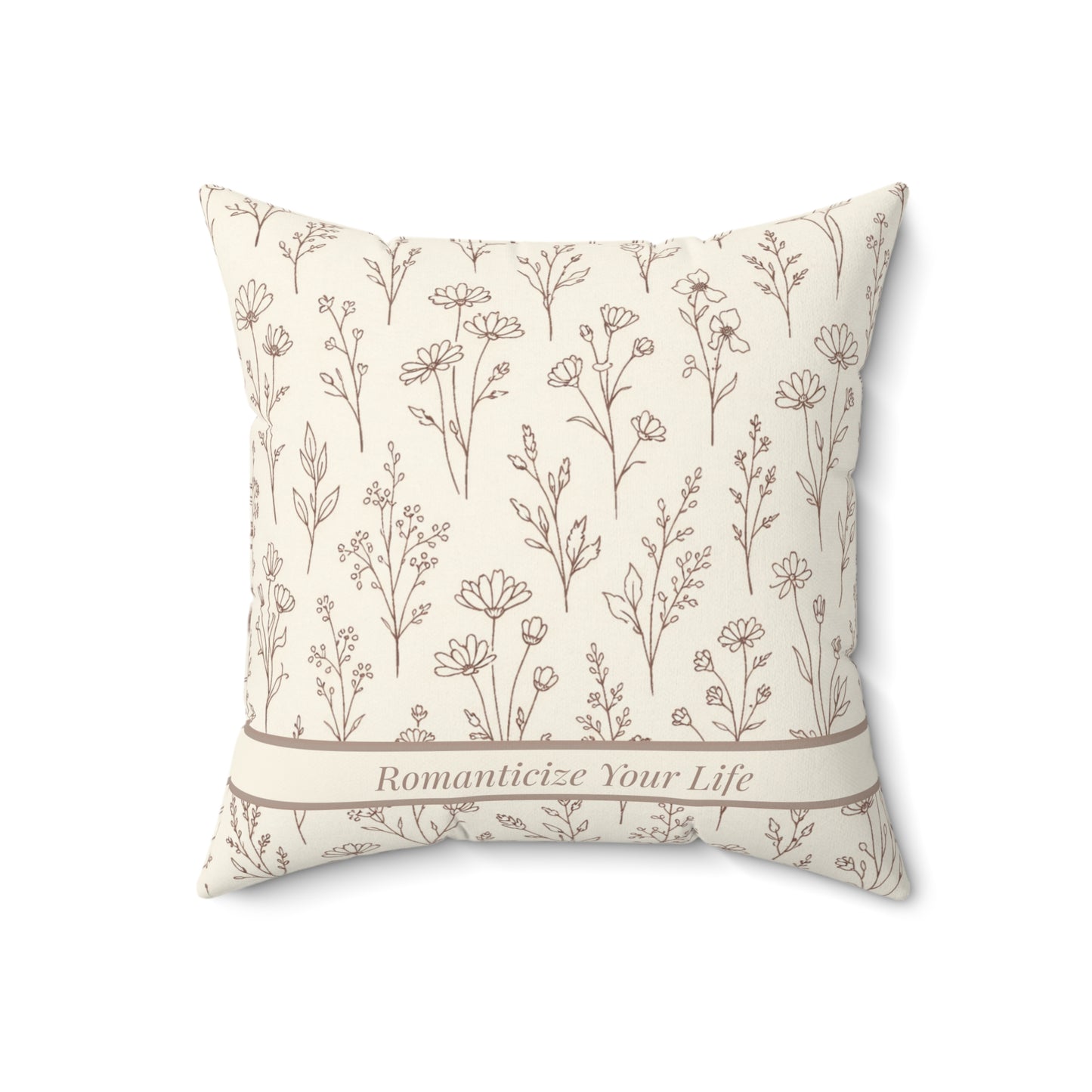 Decorative pillow with geometric pattern and 'Romanticize Your Life' text on a white background