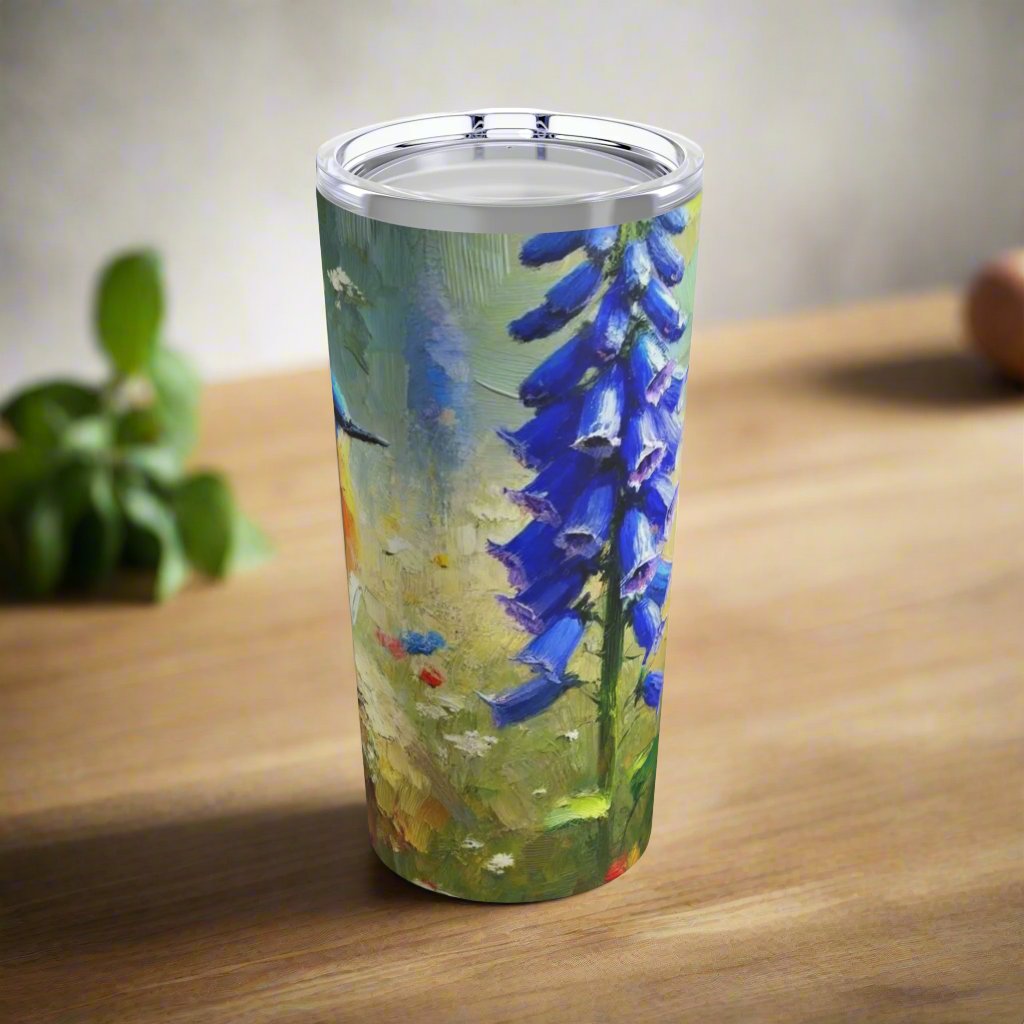 Left side view of the 20oz stainless steel tumbler showcasing the detailed bluebird illustration with floral elements.
