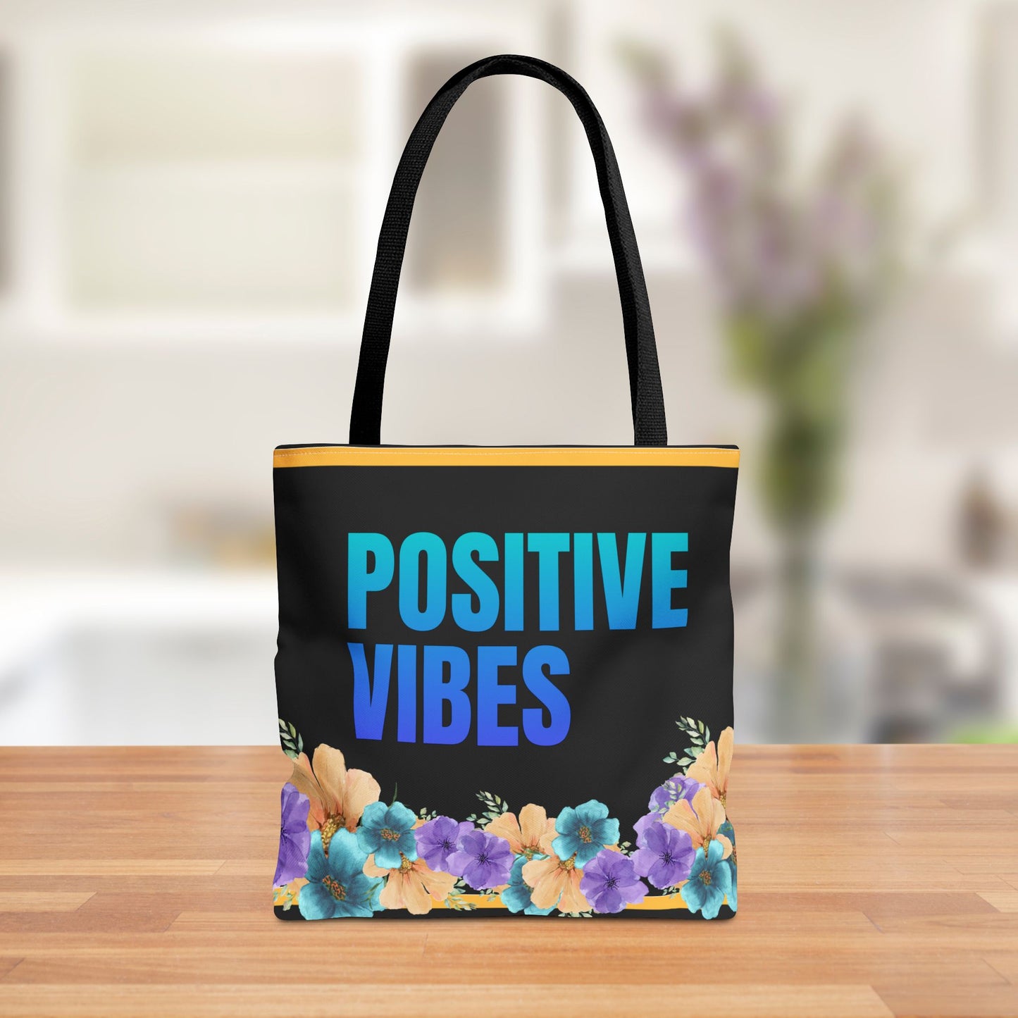 Front view of the Positive Vibes Floral Tote Bag with gradient blue text and pastel flowers.