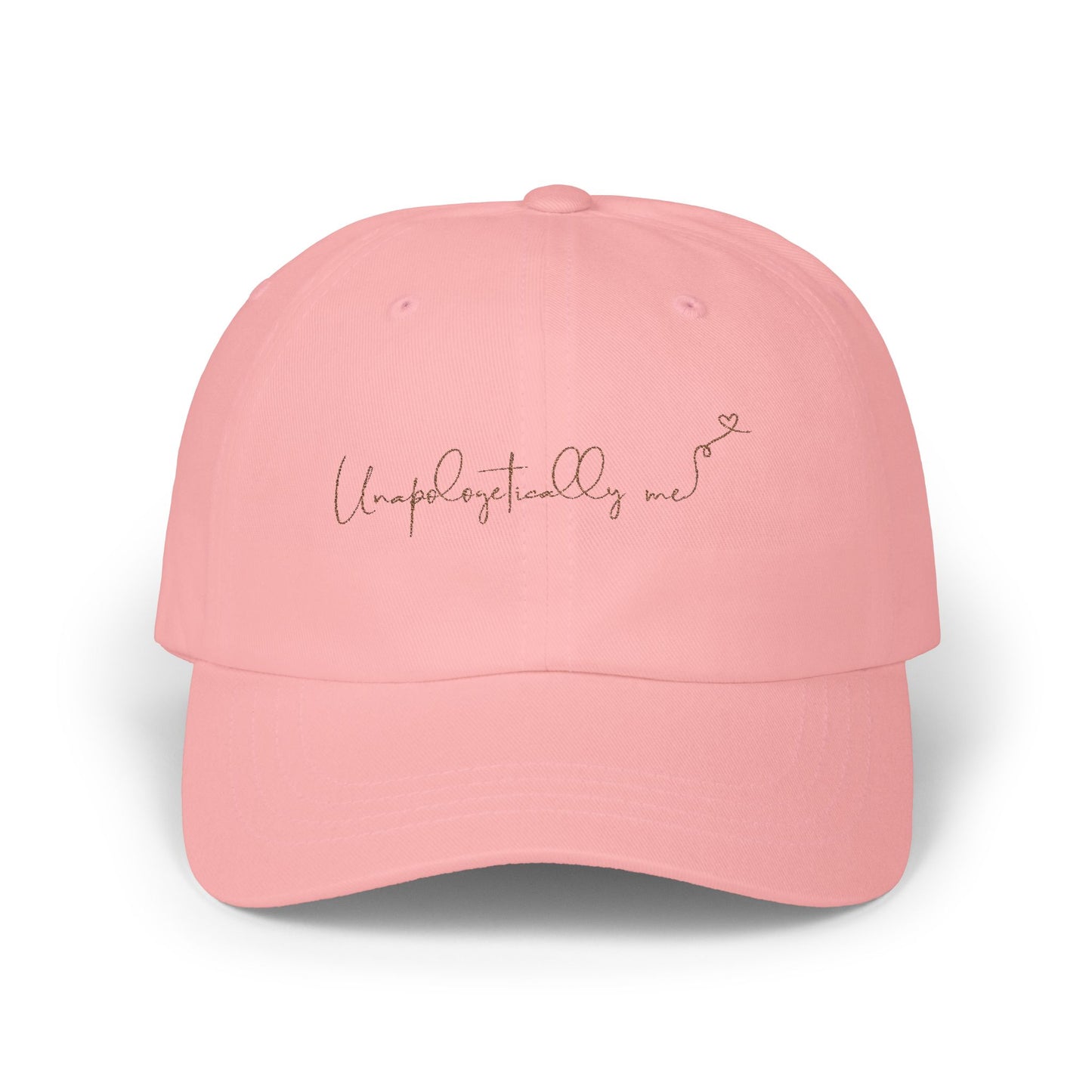 Front view of the 'Unapologetically Me' Classic Dad Hat in pink, showcasing the embroidered design on a clean, minimalist base.
