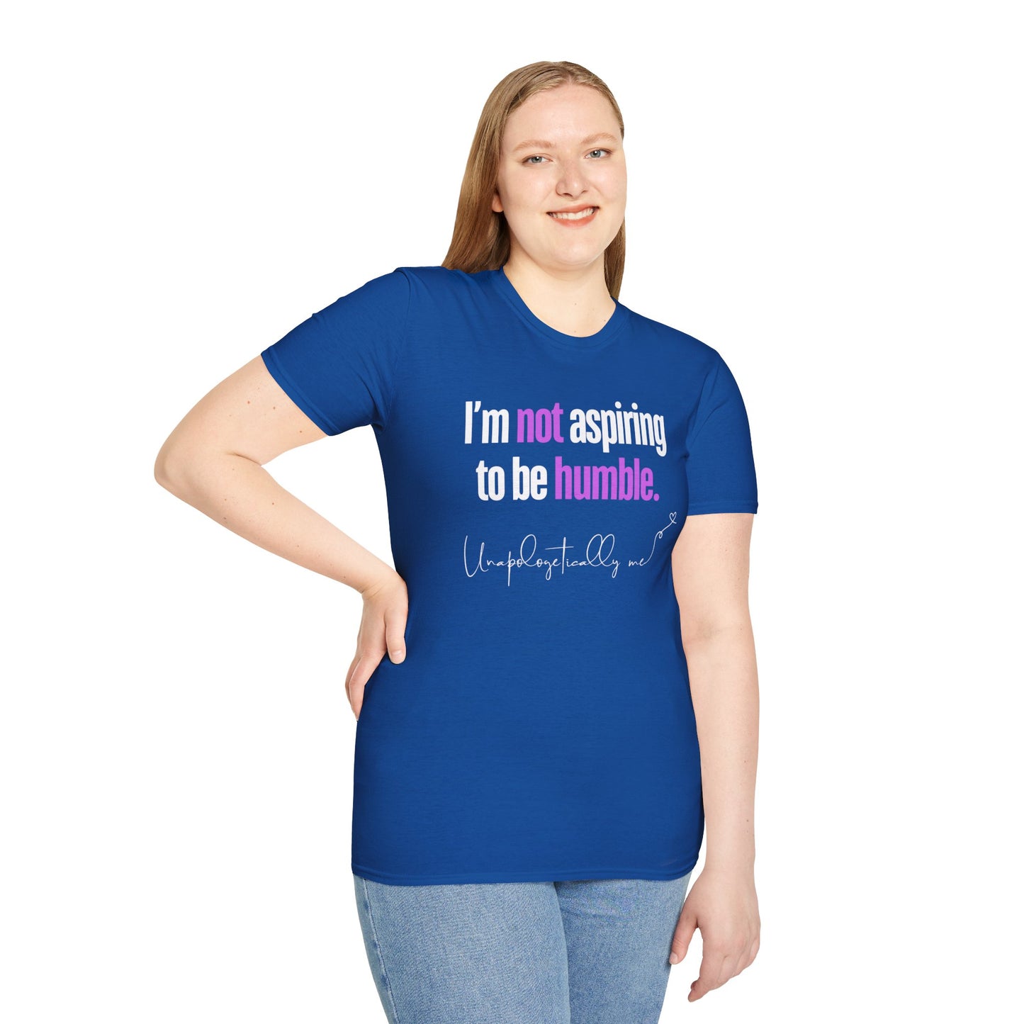 Front view of a model wearing a royal blue unisex t-shirt with the phrase “I’m not aspiring to be humble” in bold letters.